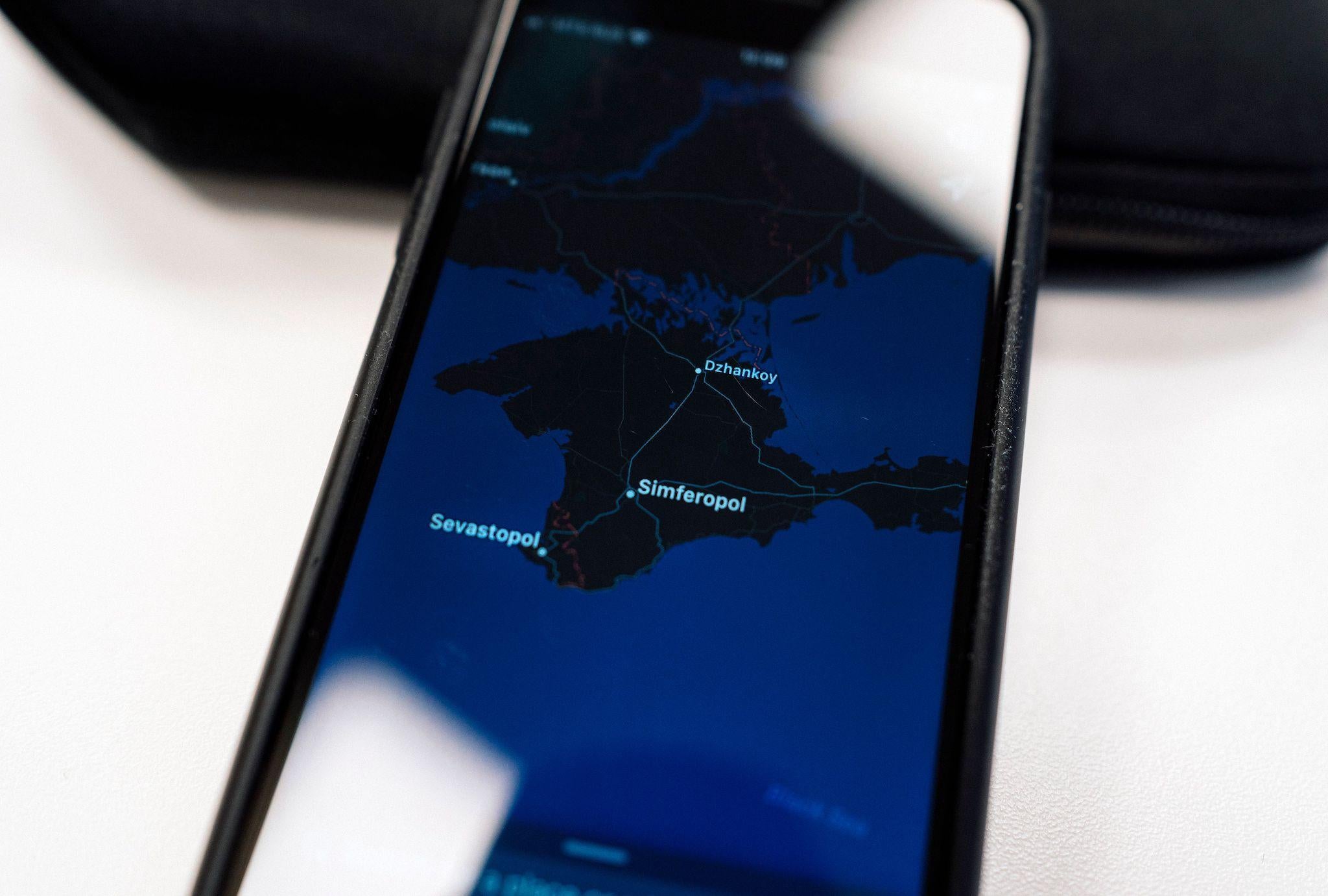 An illustration picture taken on November 28, 2019 in Moscow shows an Apple map with the Crimea peninsula on a smartphone screen