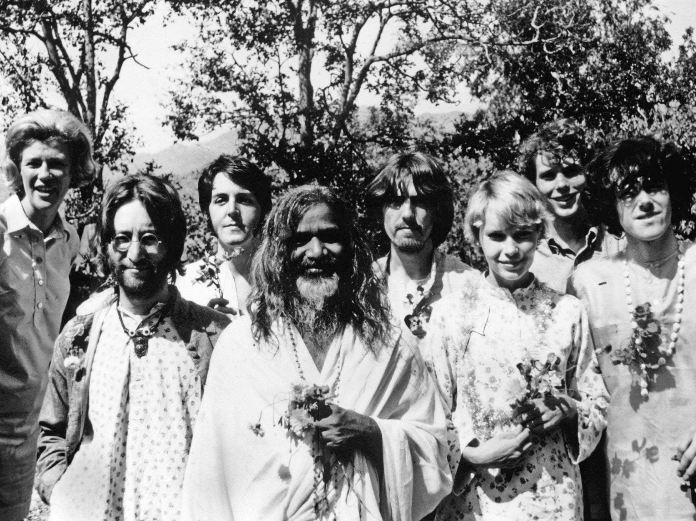 The Beatles with actress Mia Farrow and singer Donovan posing with the Maharishi Mahesh in 1968 (Gamma-Keystone via Getty)