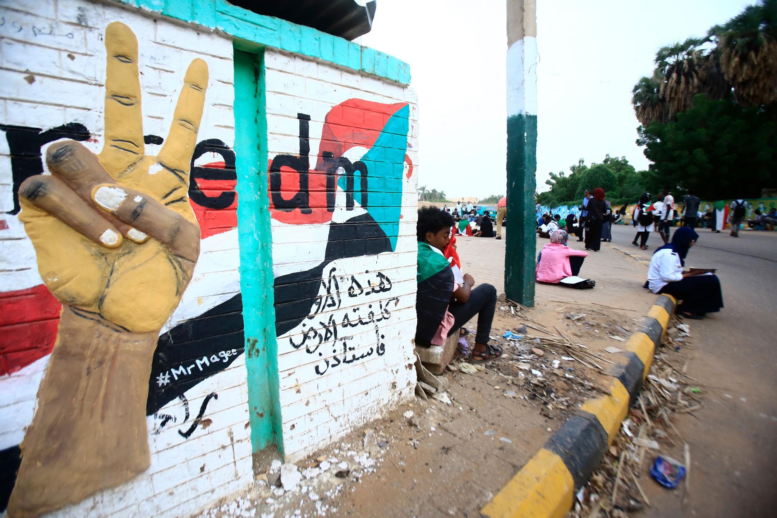 Sudanese demonstrators gather near Nile Street in the capital Khartoum, demanding officials be held accountable for the killings of protesters during the June 3 crackdown (AFP)