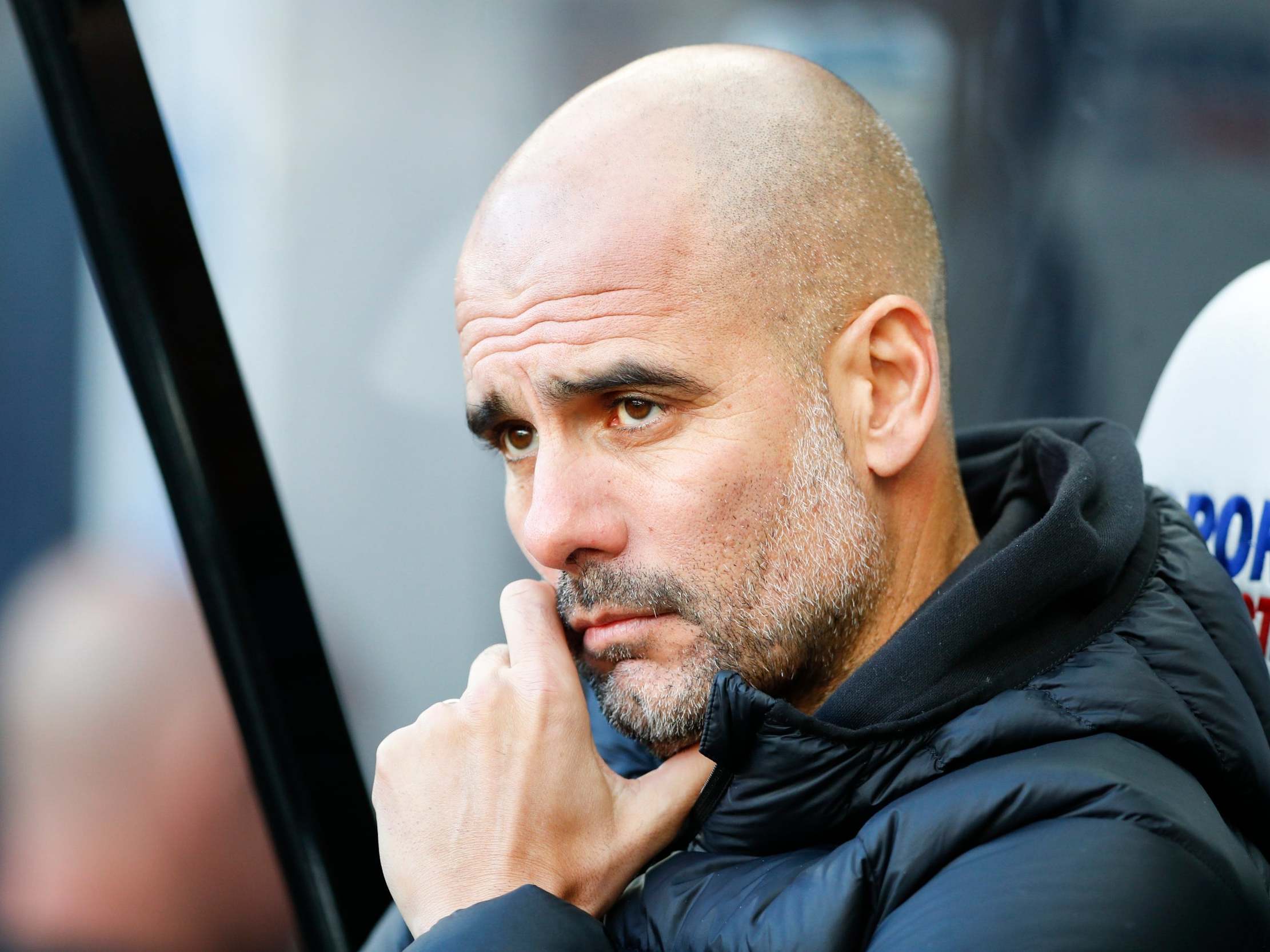 Pep Guardiola watches on from the dugout