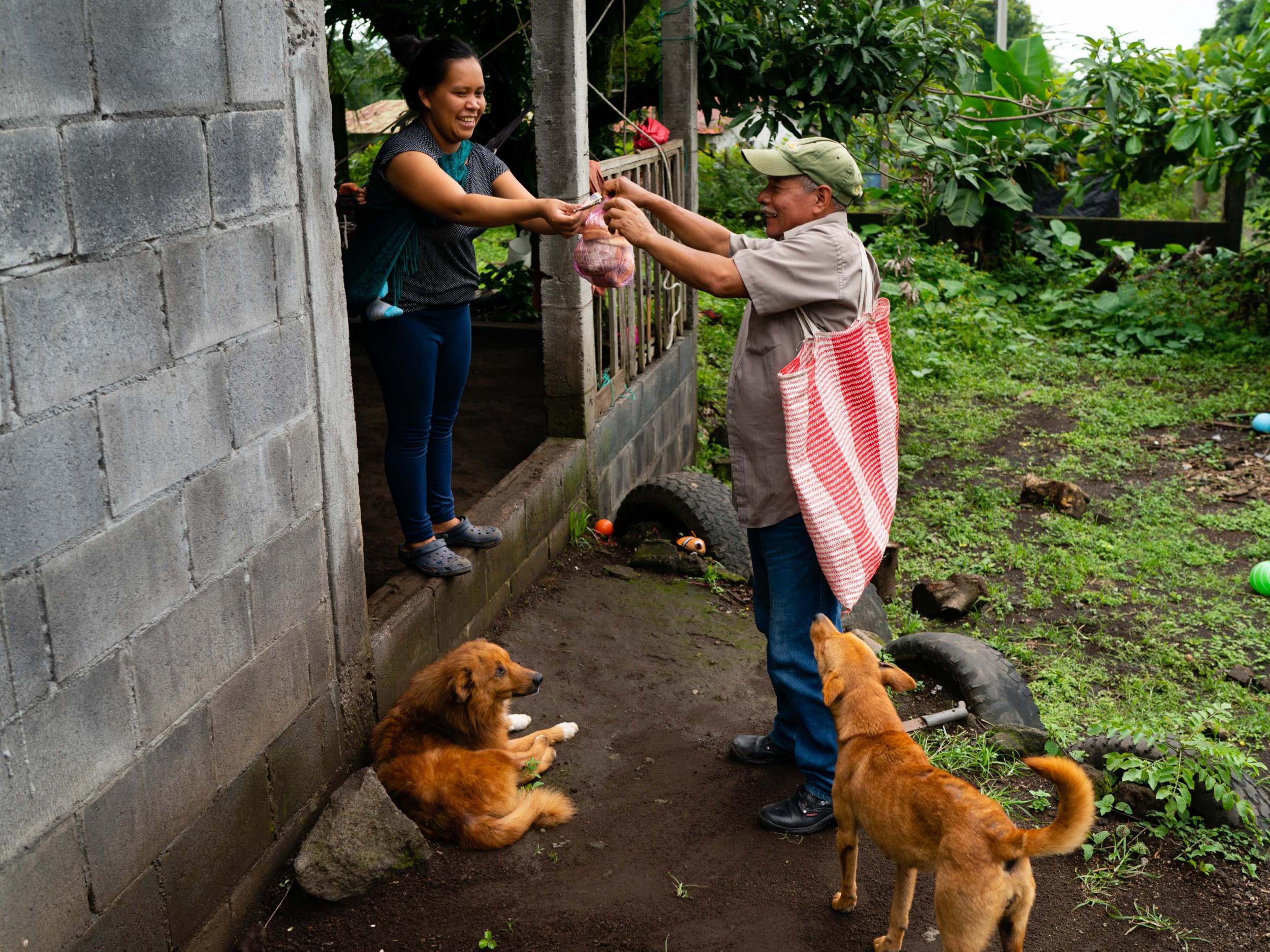 Rosalba Thomas Diego buys homemade bread from Camposeco (The Washington Post)