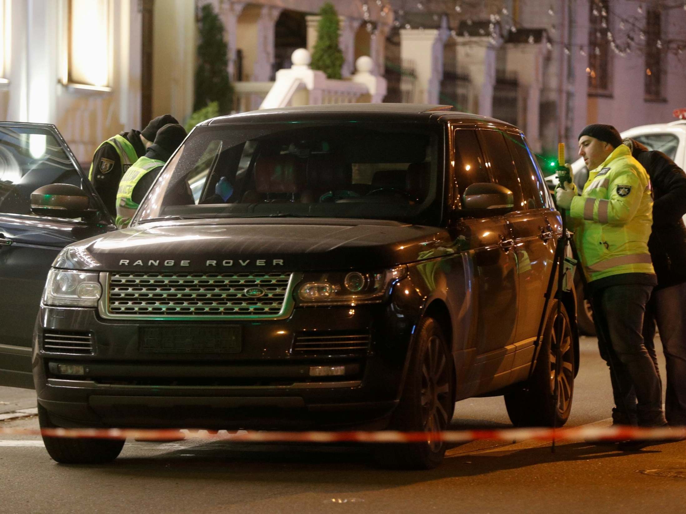 Investigators inspect Vyacheslav Sobolev's car in Kiev, Ukraine