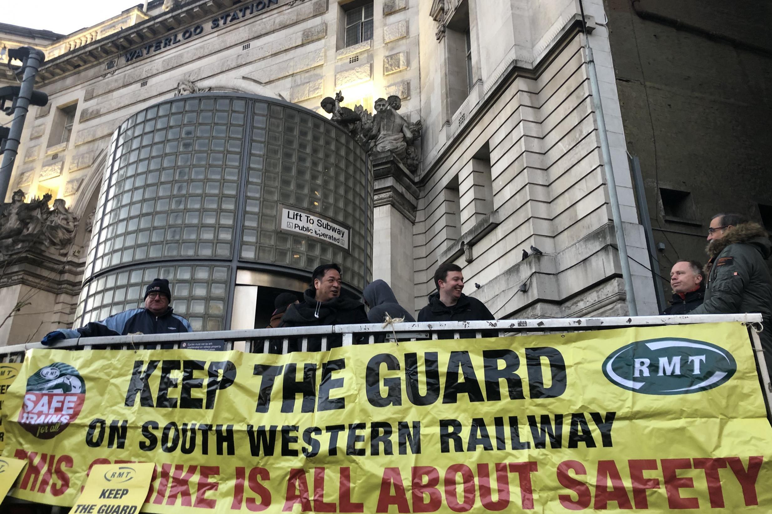 Line men: RMT union pickets outside Waterloo station in central London