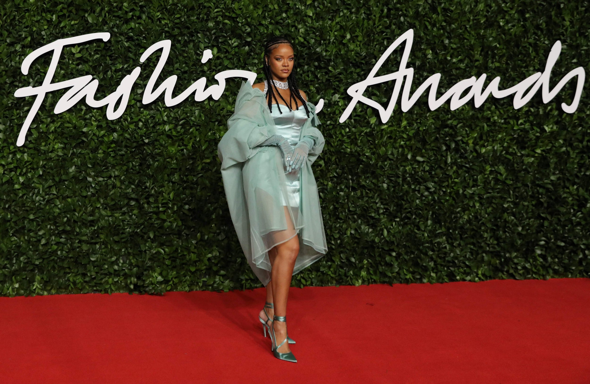 The singer stunned in an ensemble from her eponymous Fenty fashion label, a combination of a baby blue mini dress, a sheer jacket, elegant gloves and matching strappy heels