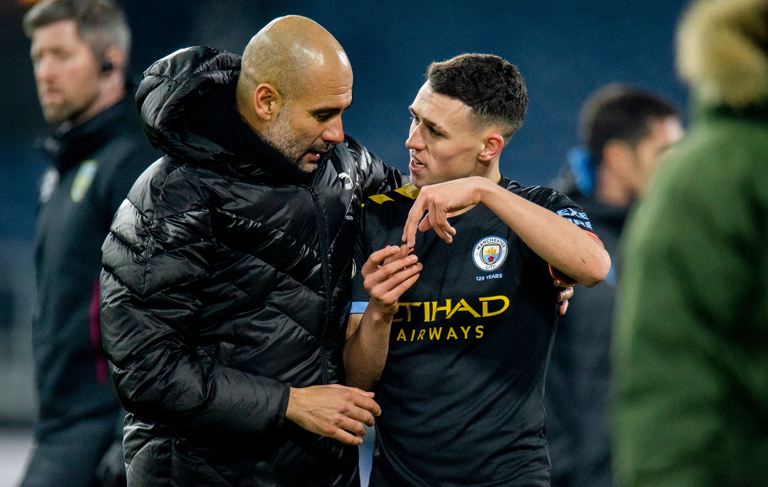 Pep Guardiola in conversation with Phil Foden at full-time