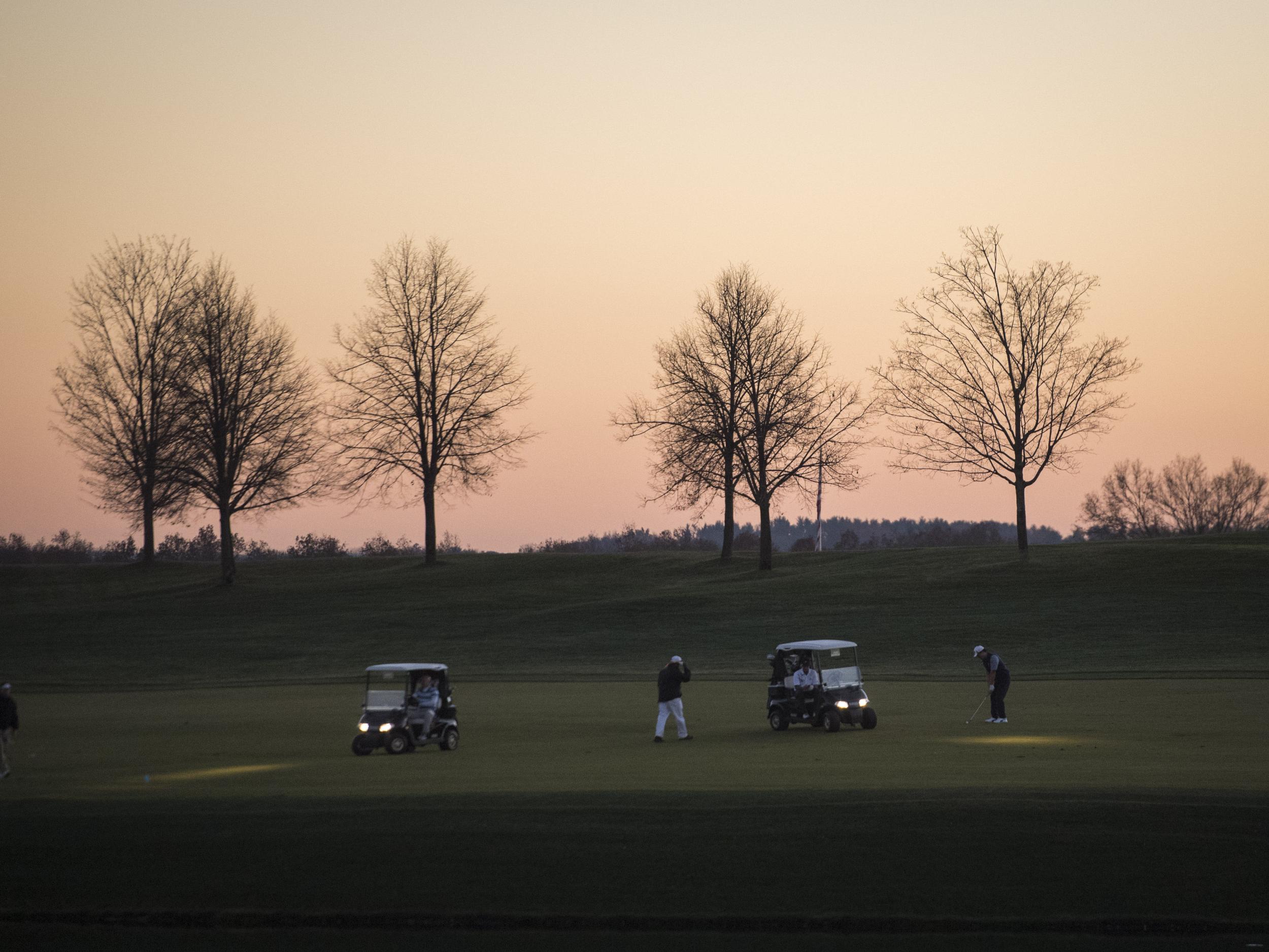 People play golf at Trump National Golf Club Bedminster