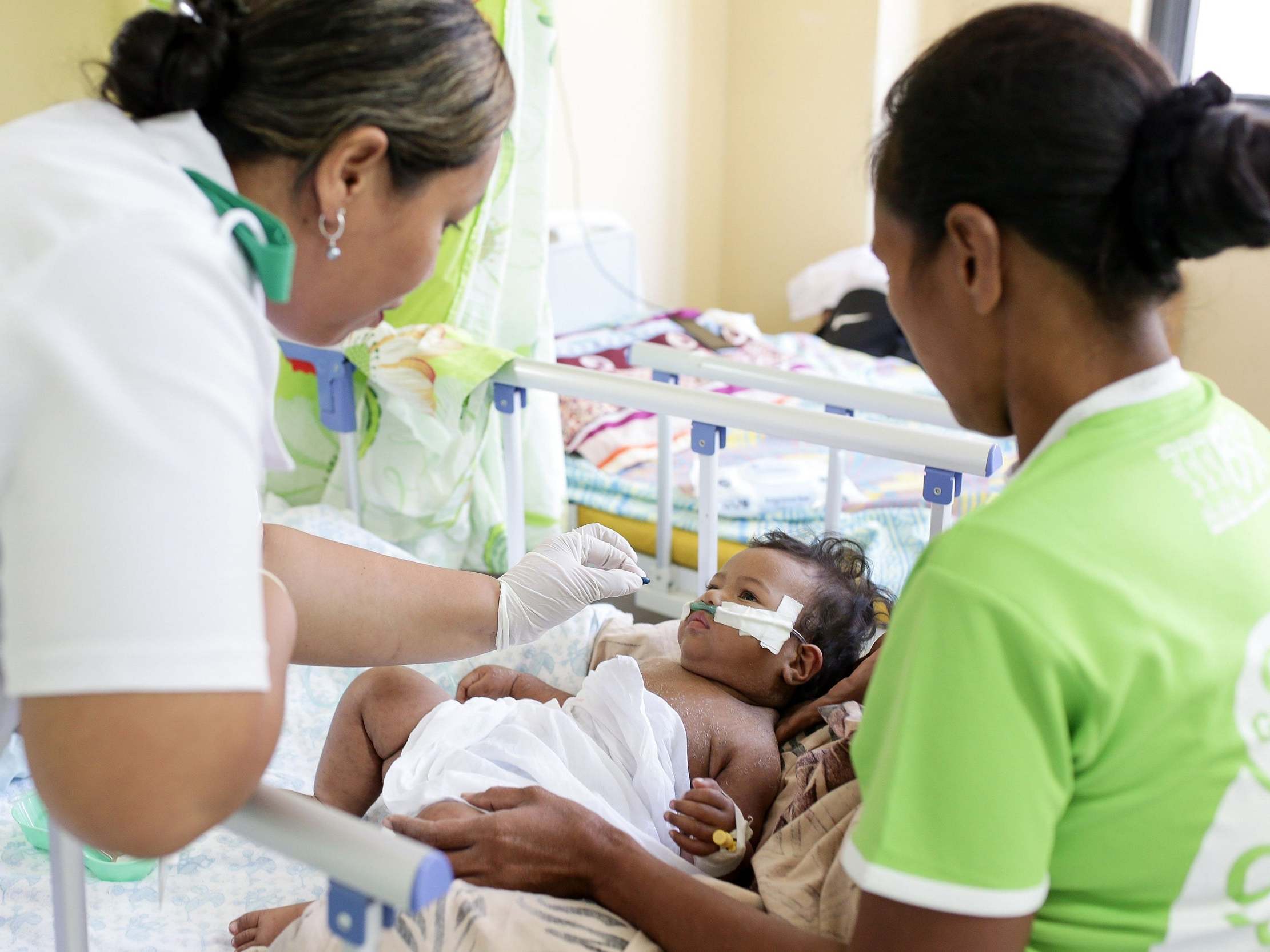 Unicef Samoa shows young girl receiving a vitamin A supplement in Samoa's capital city, Apia