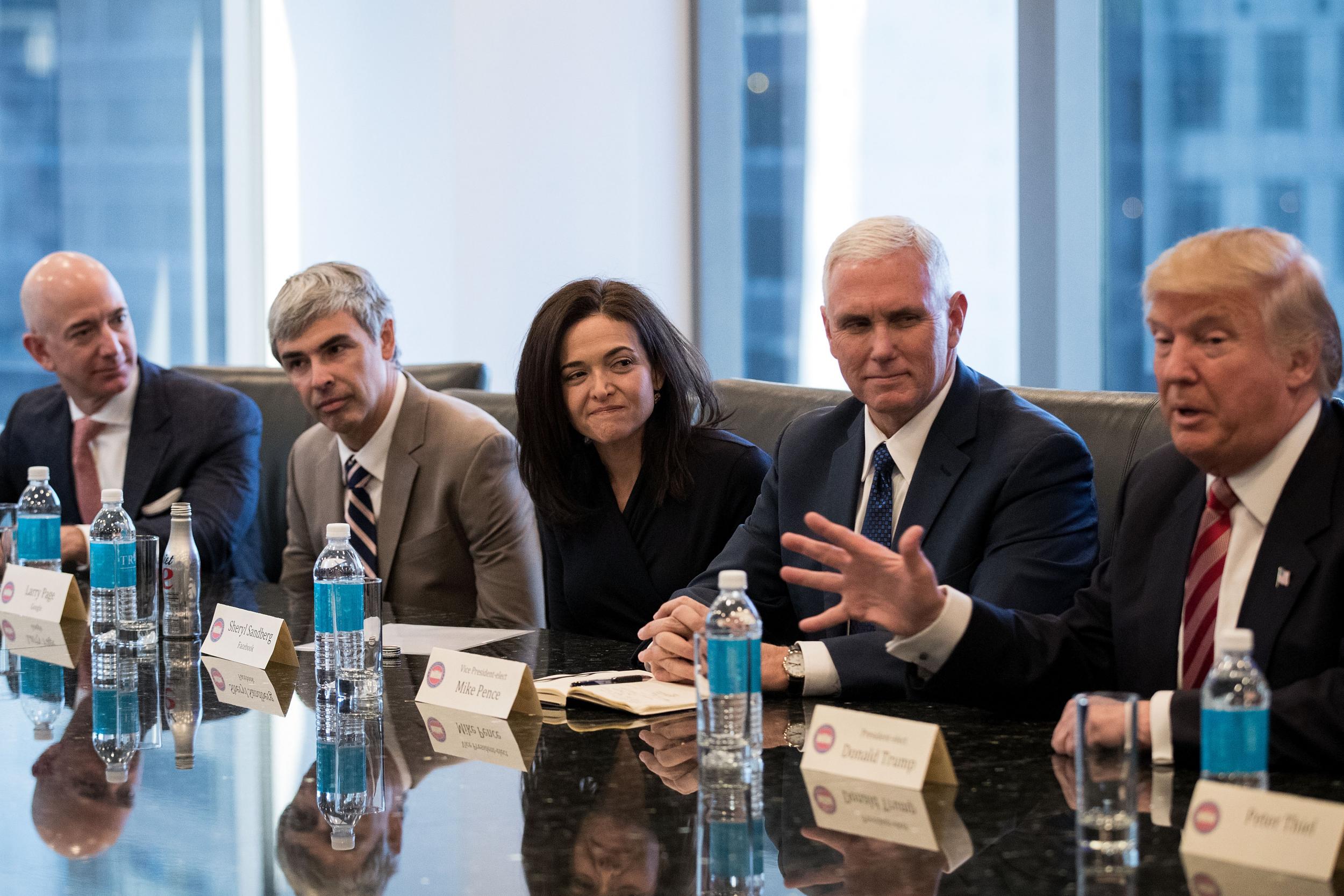 Jeff Bezos (left) was among the tech industry leaders who met with president-elect Donald Trump in December 2016 (Getty)