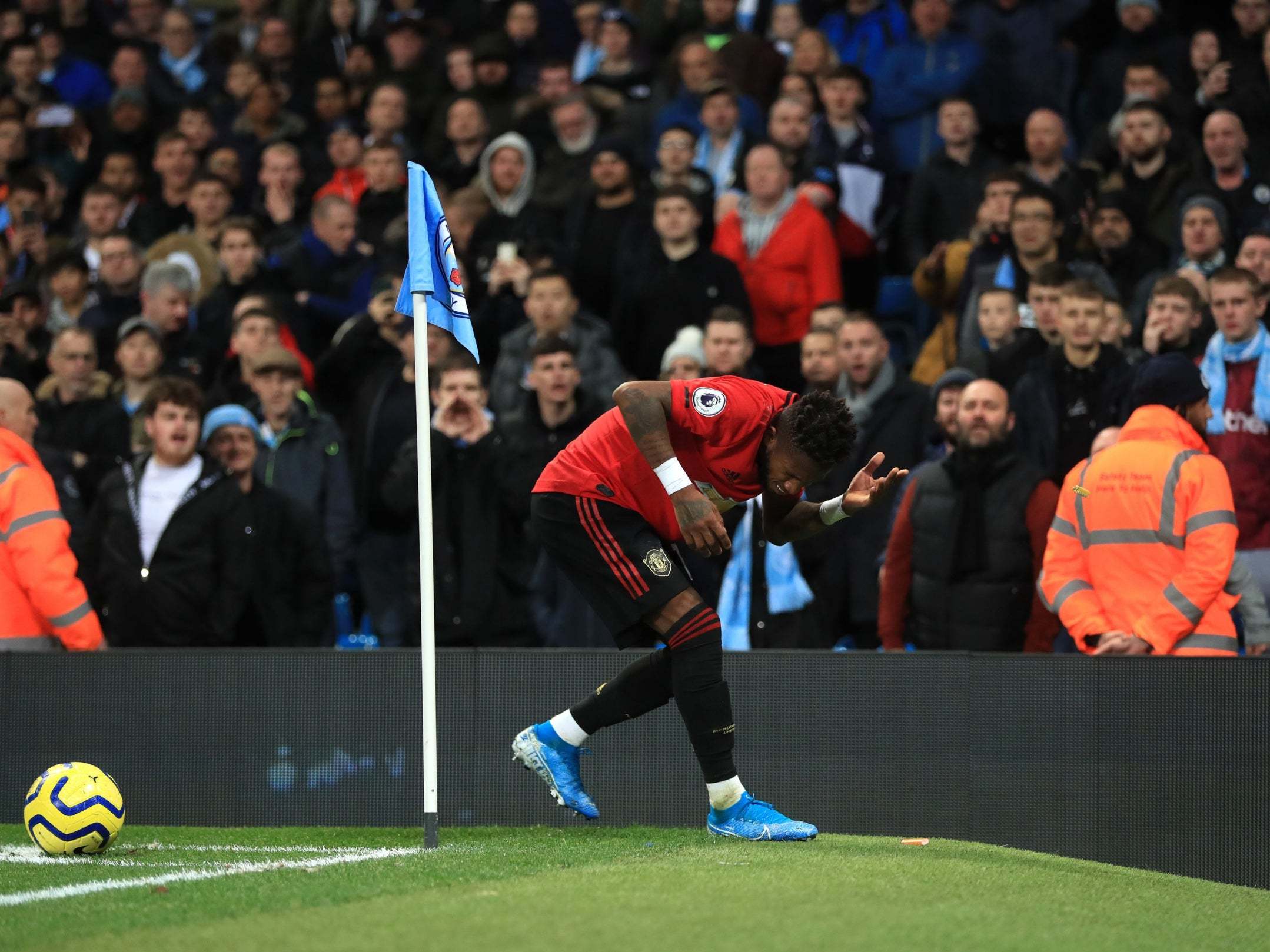 Manchester United midfielder Fred appeared to be hit by an object during the win over City