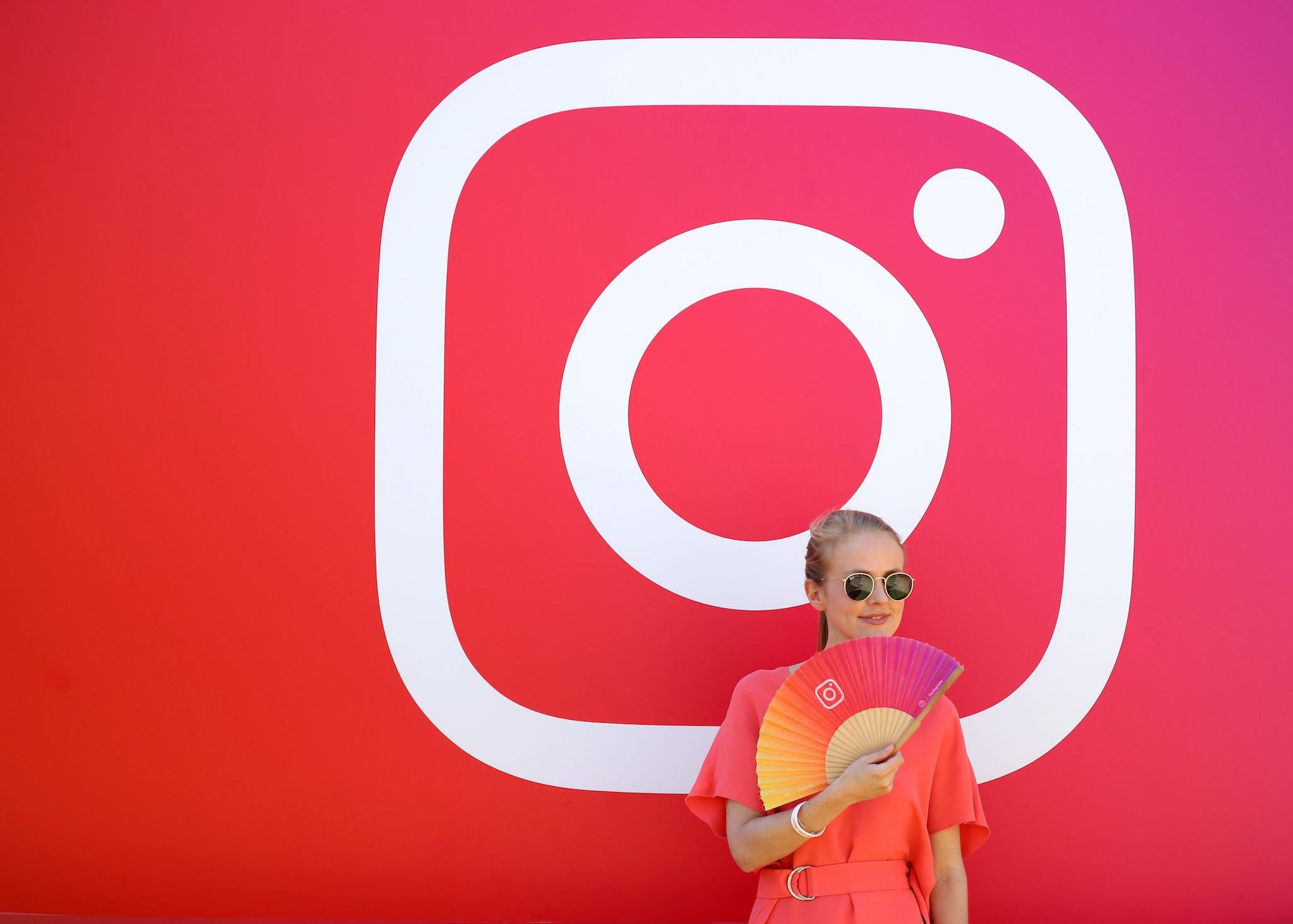 A visitor stands in front of the Instagram stand during day two of Dubai Lynx 2019