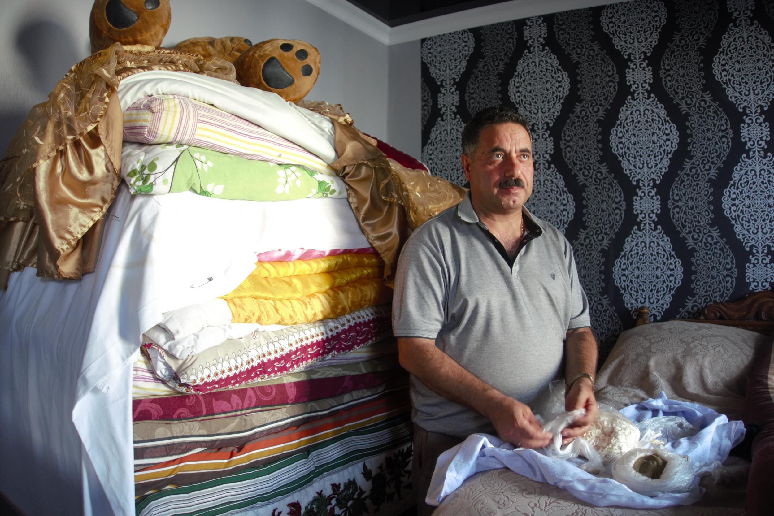 ‘When the sun is not visible, I open this shrine and pray to it,’ says Edik Pir Drbes, in front of his stack of holy mattresses