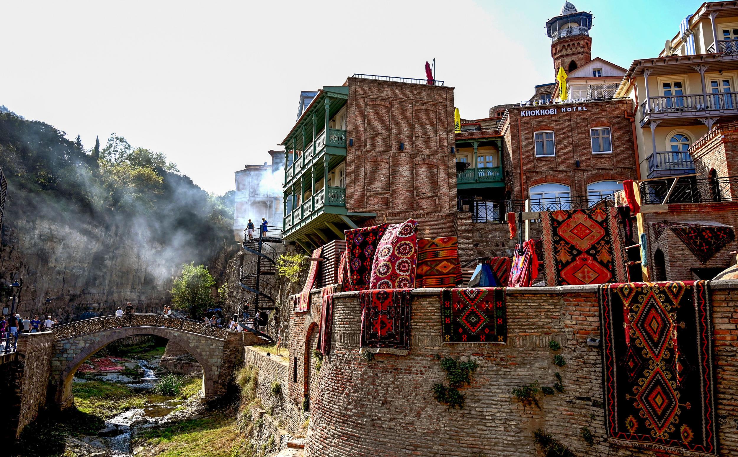 Antique carpets hung on walls in downtown Tbilisi