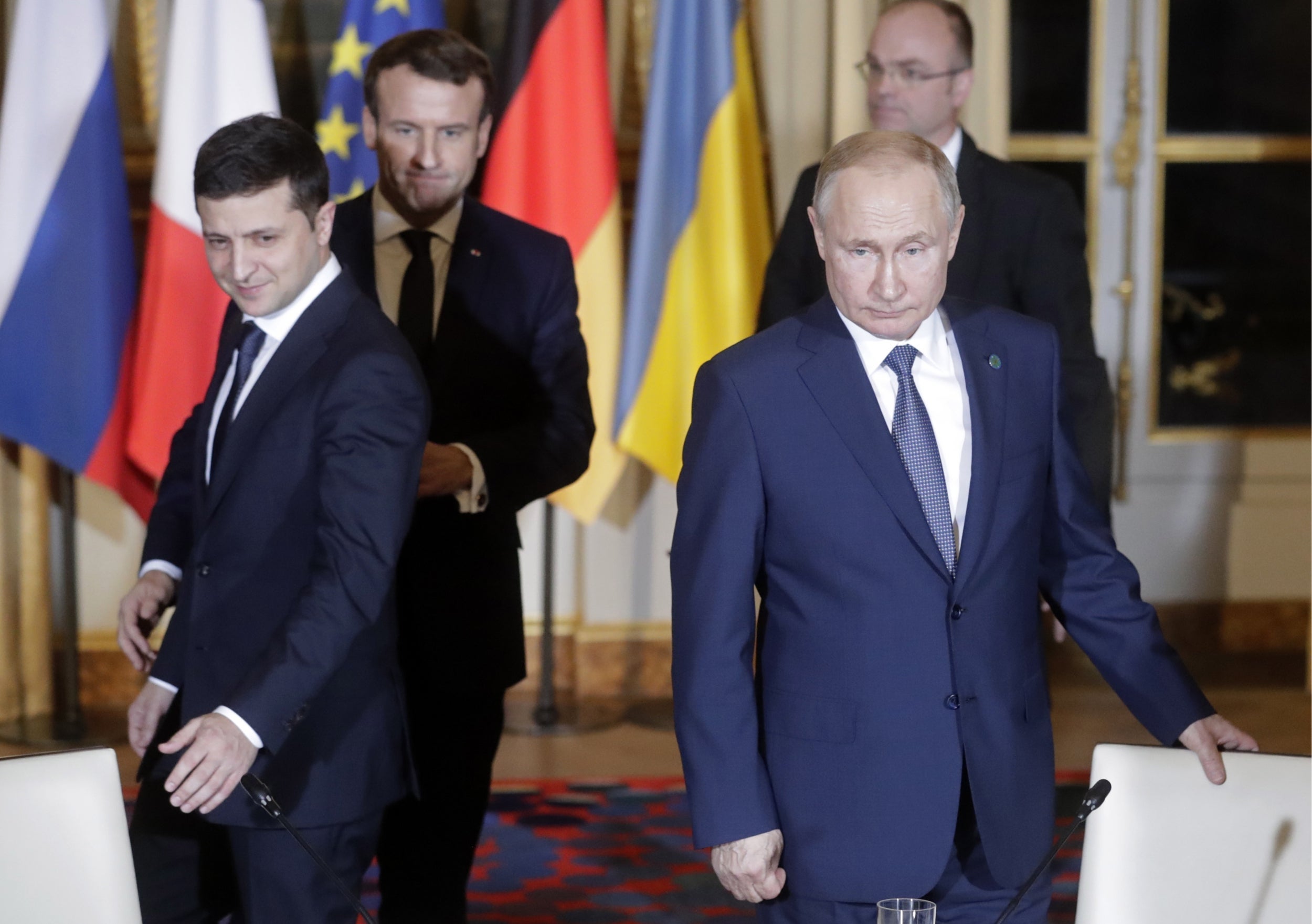 Volodymyr Zelensky (left) with Emmanuel Macron and Vladimir Putin in Paris