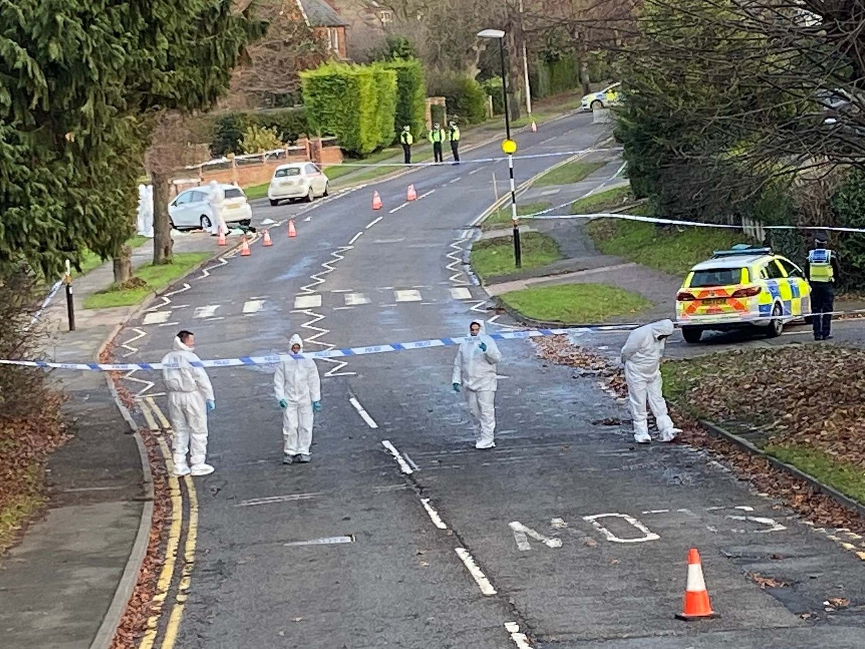 Forensic and police officers search Wellingborough Road in Rushden