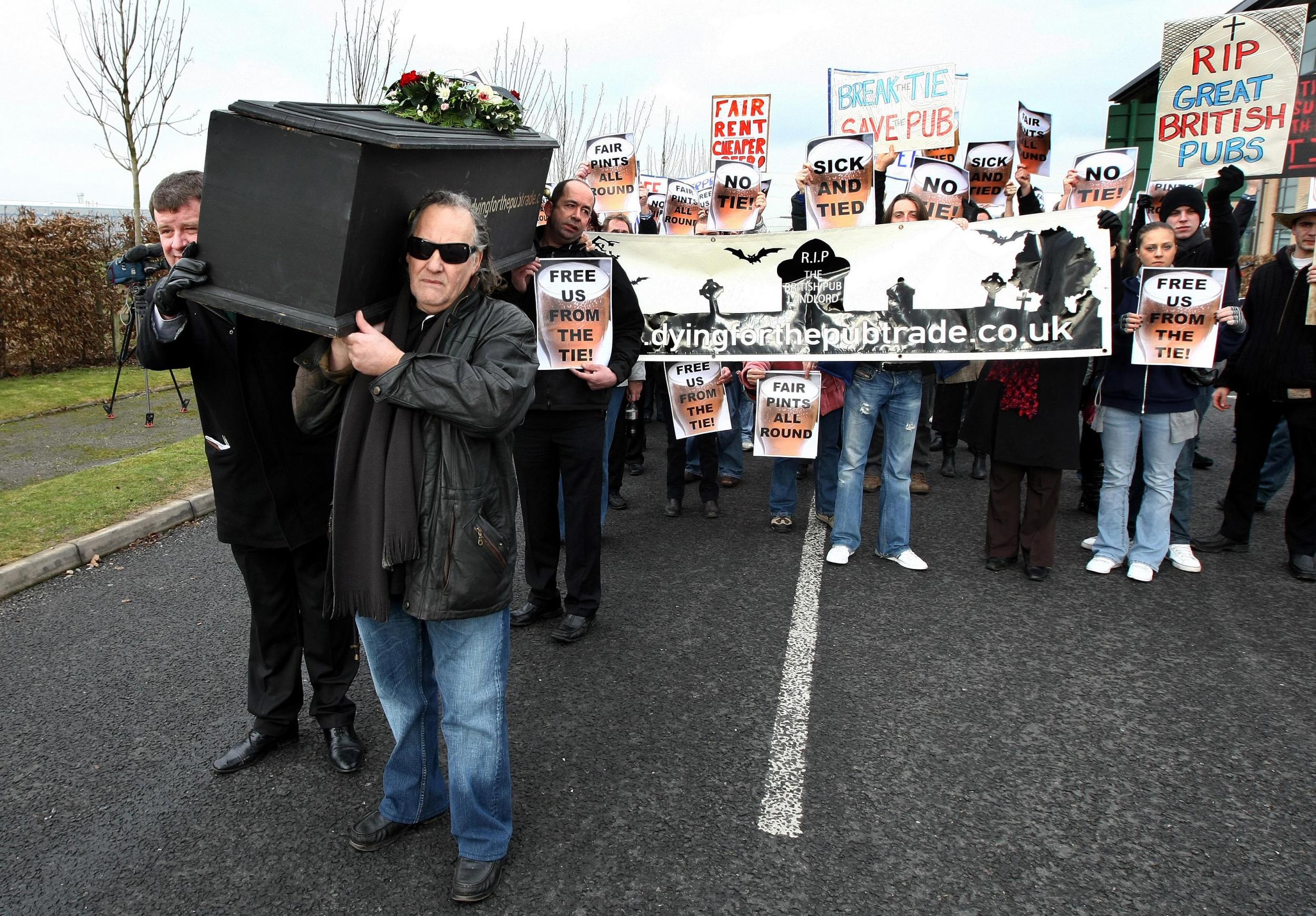 Pub owners from across the UK protest over rent and beer costs outside the Enterprise Inn in Solihull in 2012 (PA)