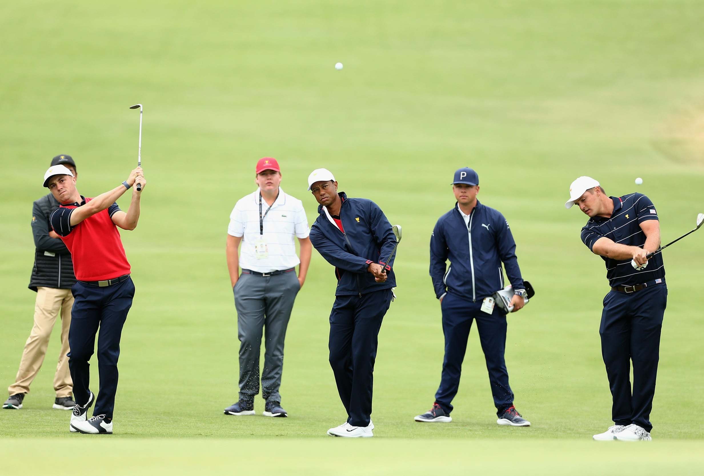 Justin Thomas, Tiger Woods and Bryson DeChambeau practice at Royal Melbourne