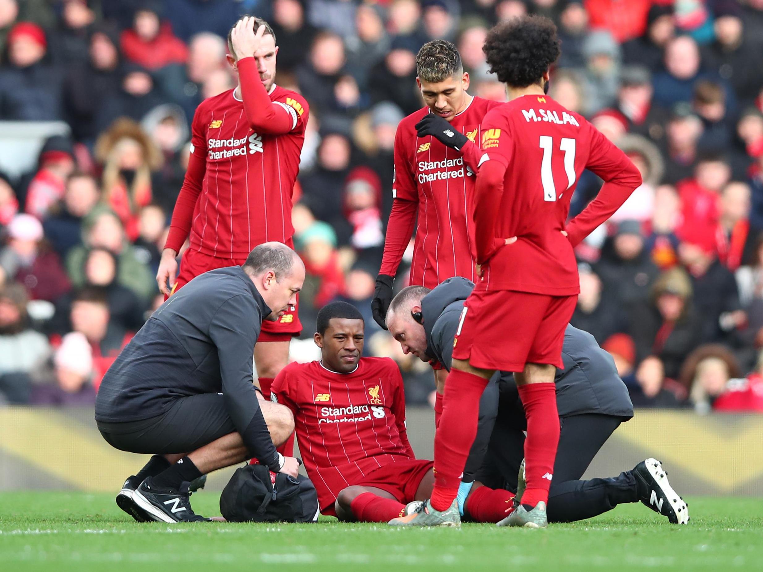 Georginio Wijnaldum receives treatment during Liverpool's win over Watford