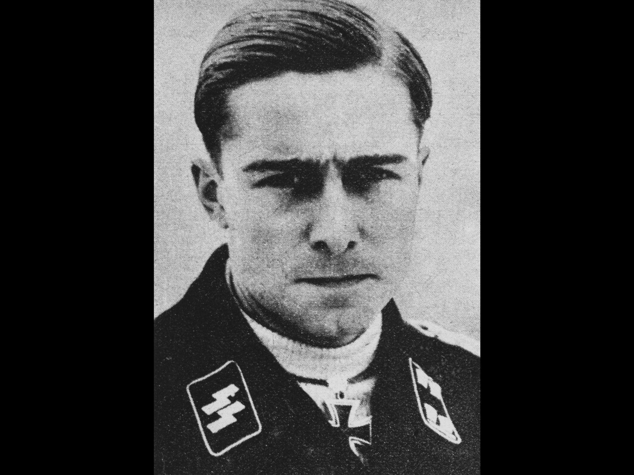 Joachim Peiper of the Waffen-SS, pictured wearing the Iron Cross awarded to him in 1940