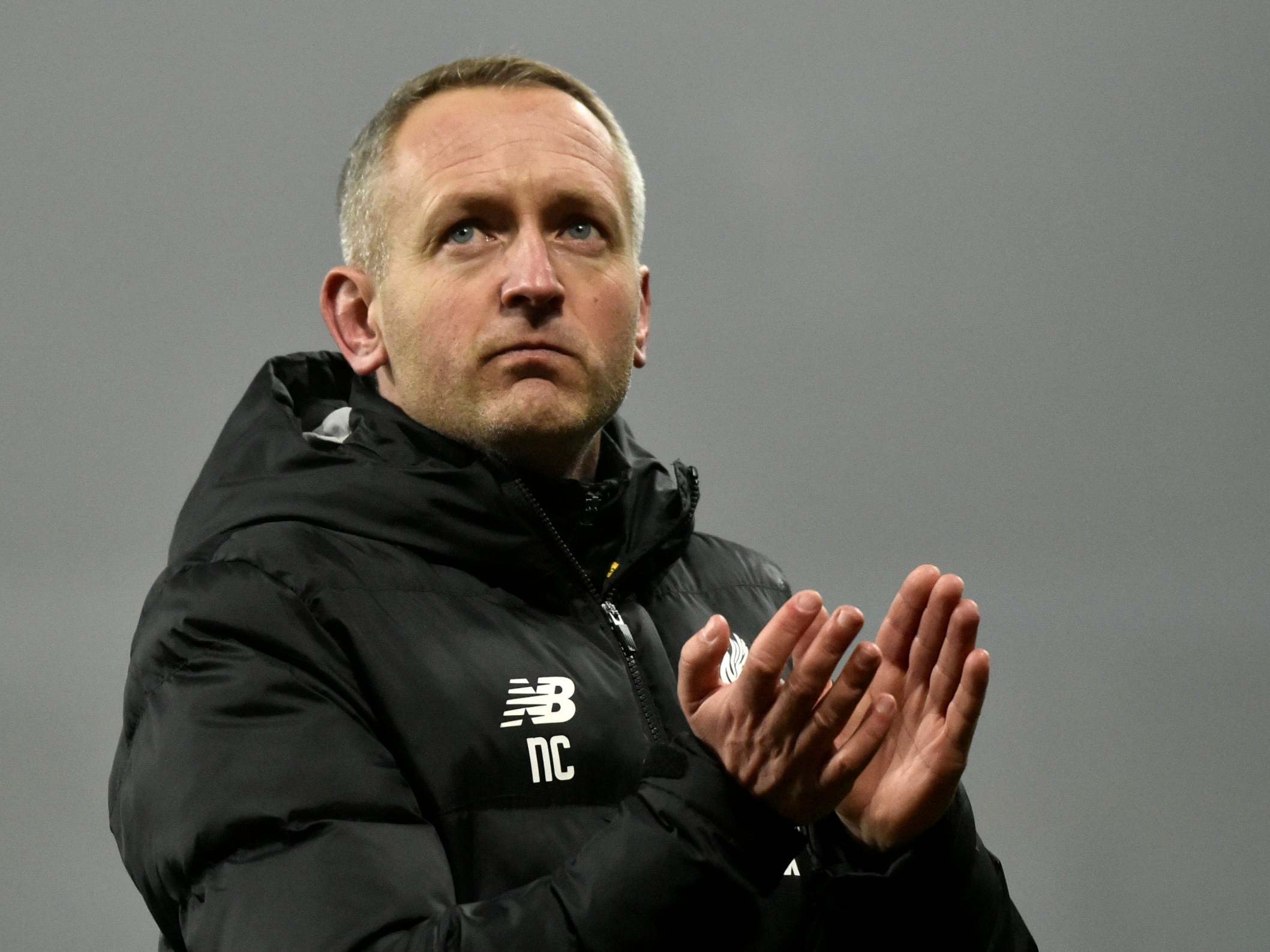 Liverpool's Under 23 coach Neil Critchley applauds to supporters at the end of the 5-0 defeat at Aston Villa