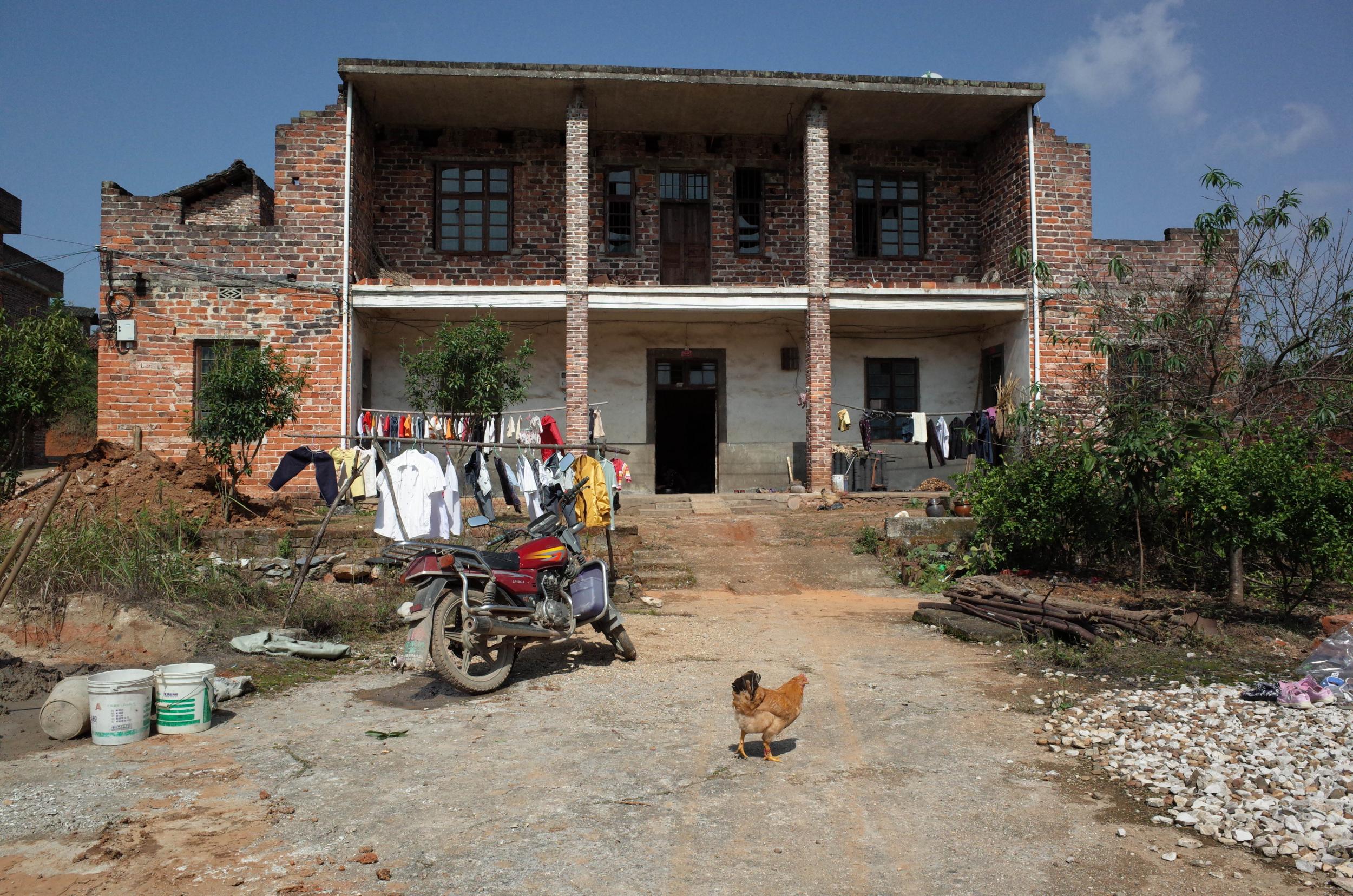 Money made in Shenzhen allowed families in Leiyang county to build bigger homes (Washington Post/Gerry Shih)