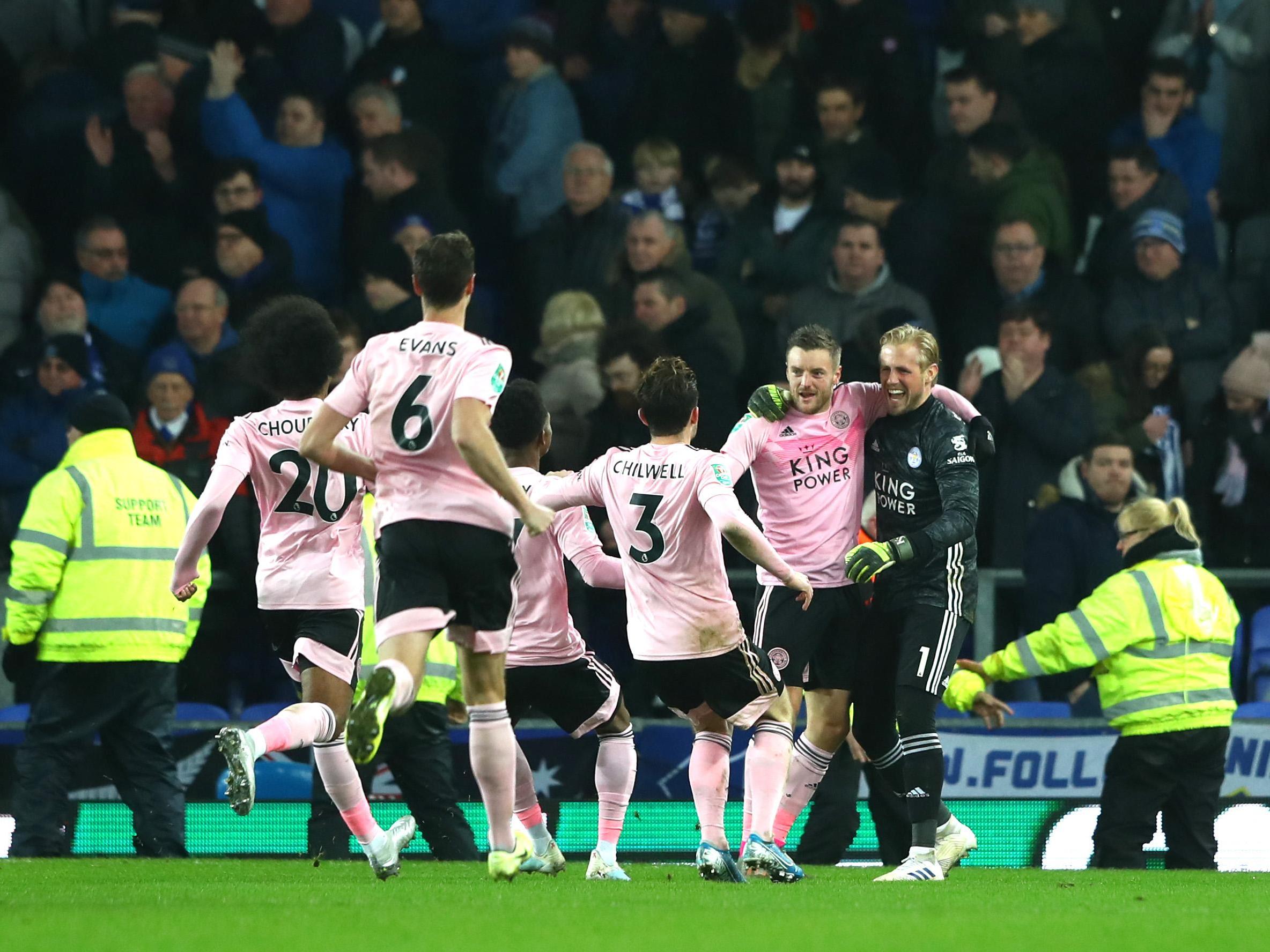 Jamie Vardy celebrates with Kasper Schmeichel after converting the winning penalty