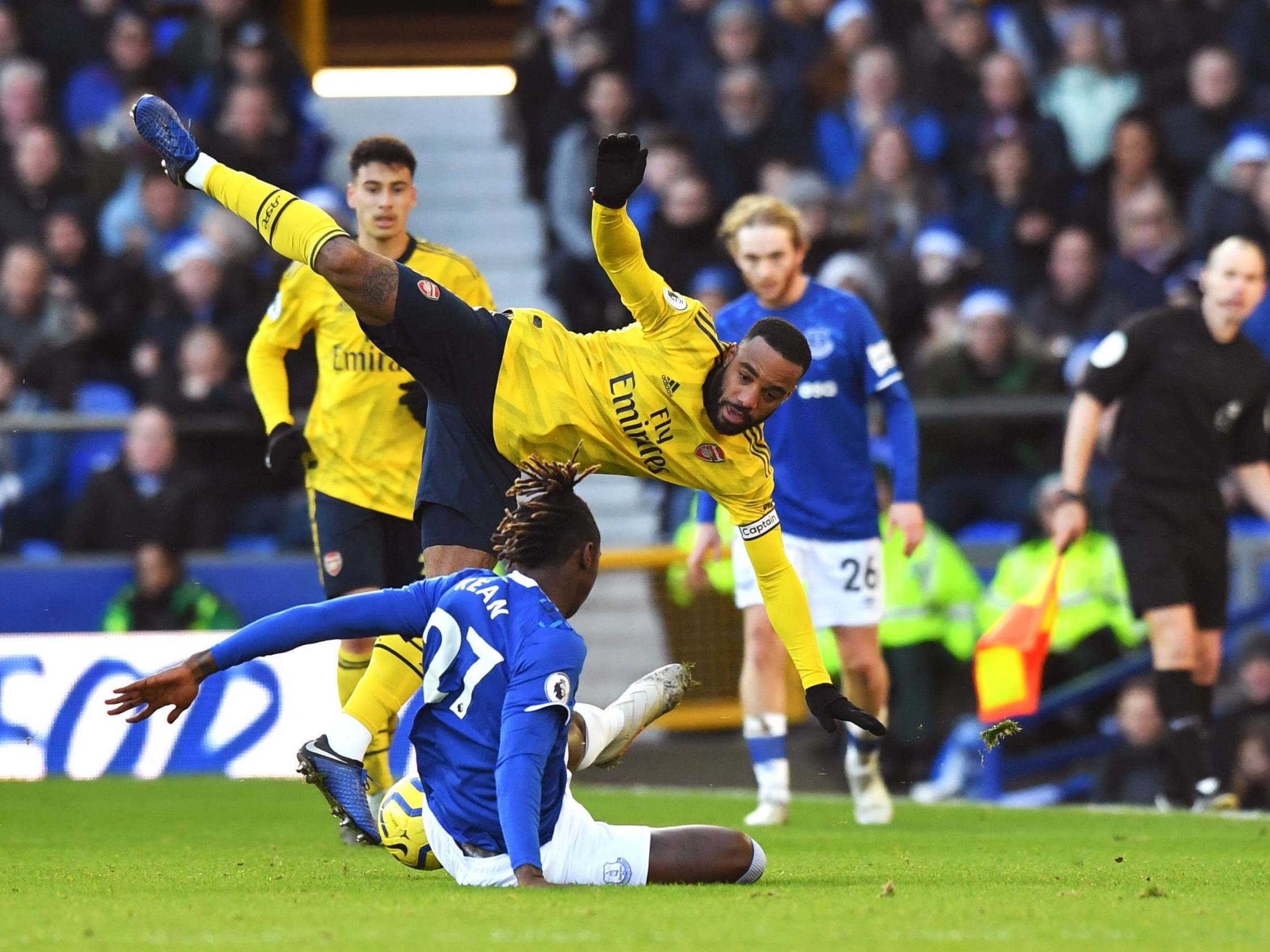 Alexandre Lacazette gets a clattering from Moise Kean