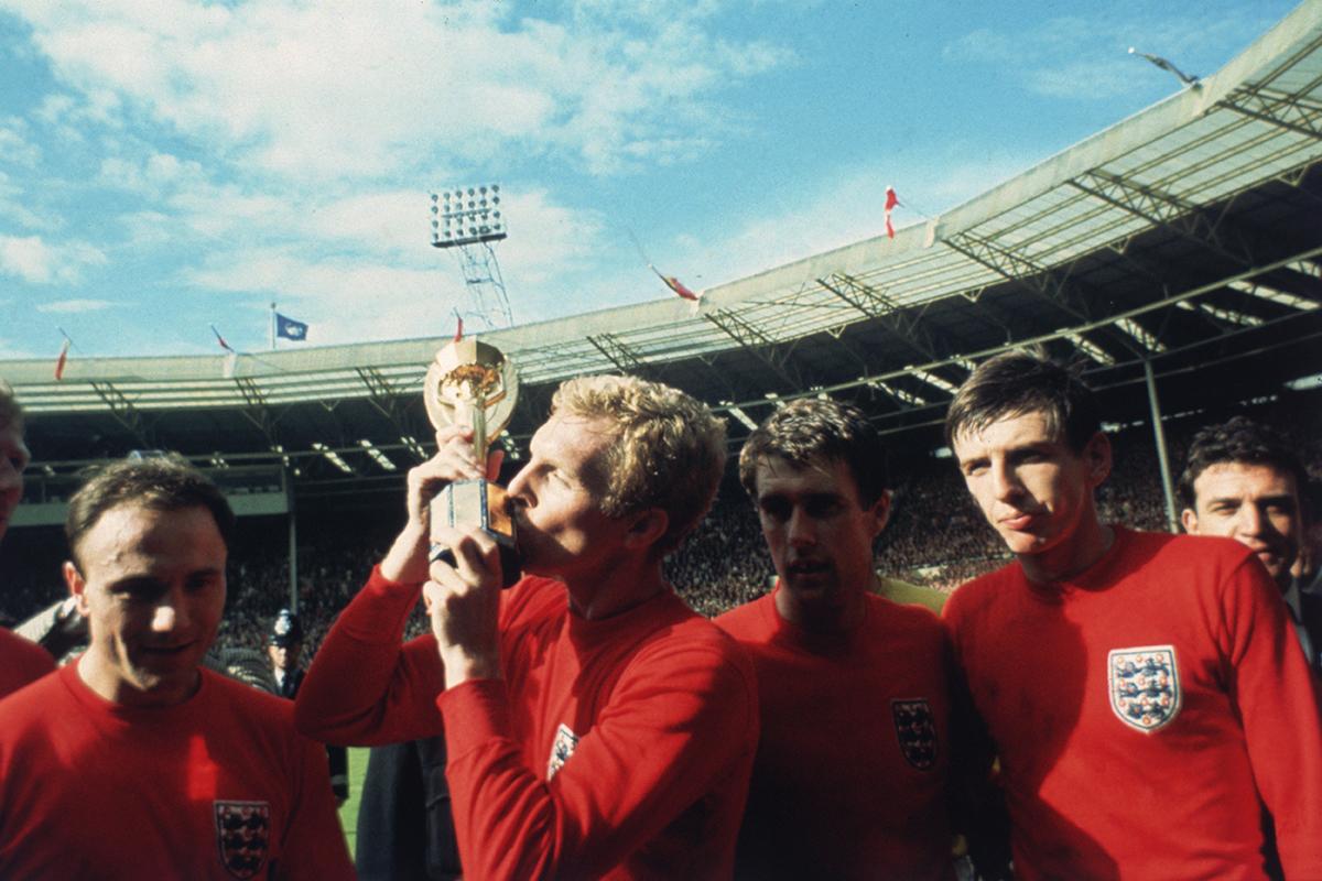 England and Peters celebrate with the Jules Rimet trophy at Wembley in 1966 (Getty)