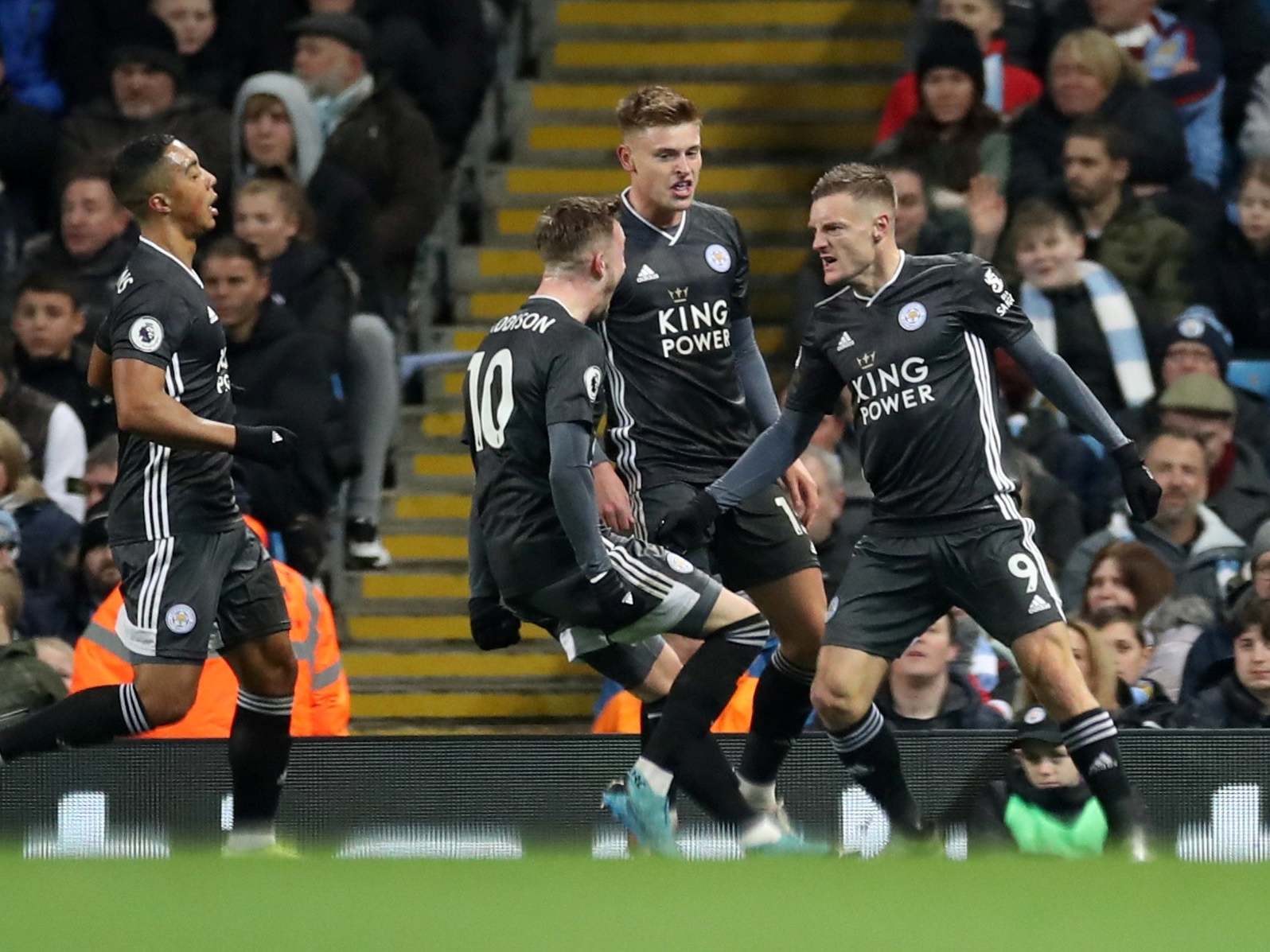 Vardy and Leicester celebrate taking the lead at the Etihad