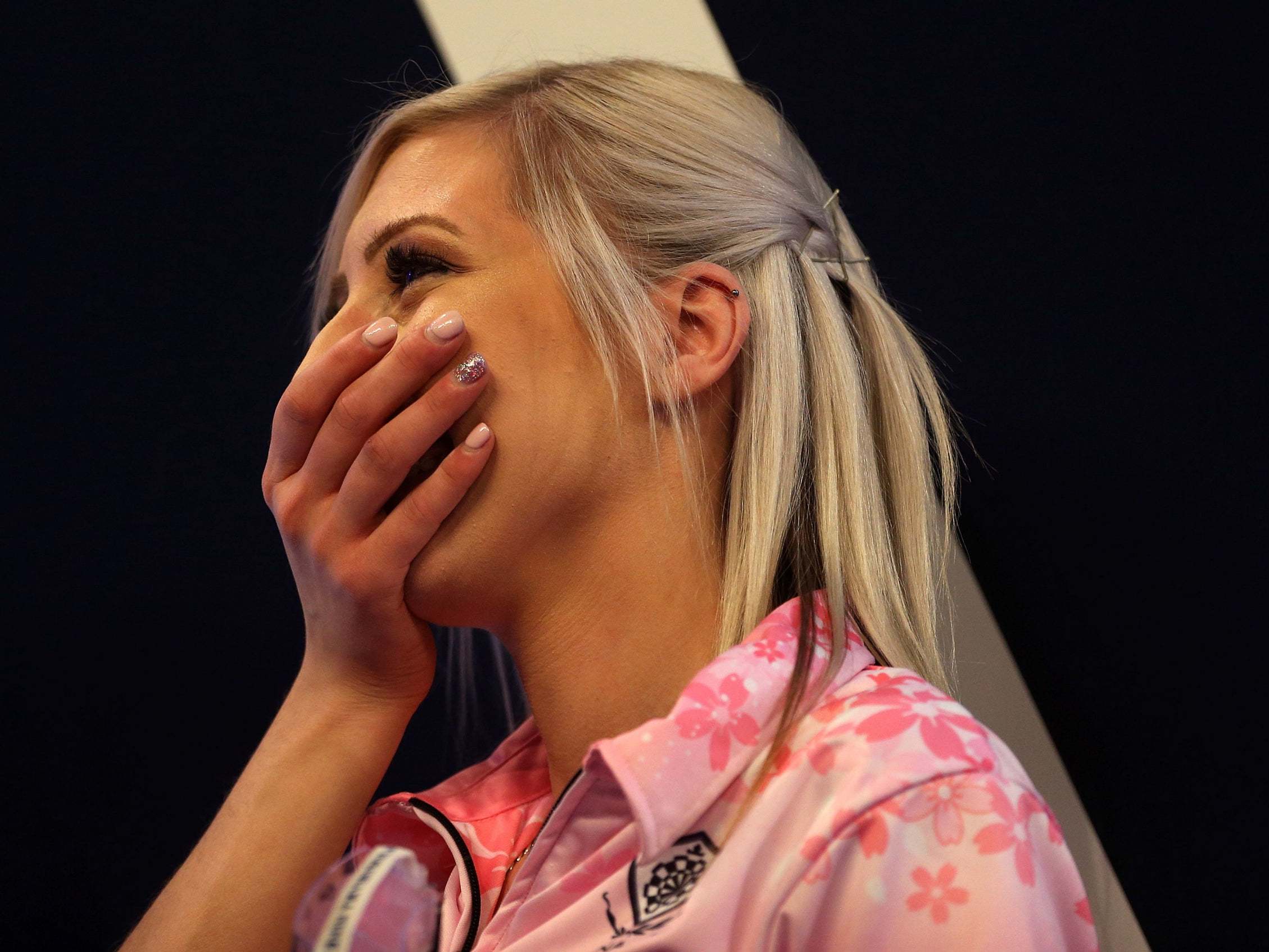 Fallon Sherrock celebrates after beating Mensur Suljovic in the second round of the World Darts Championship