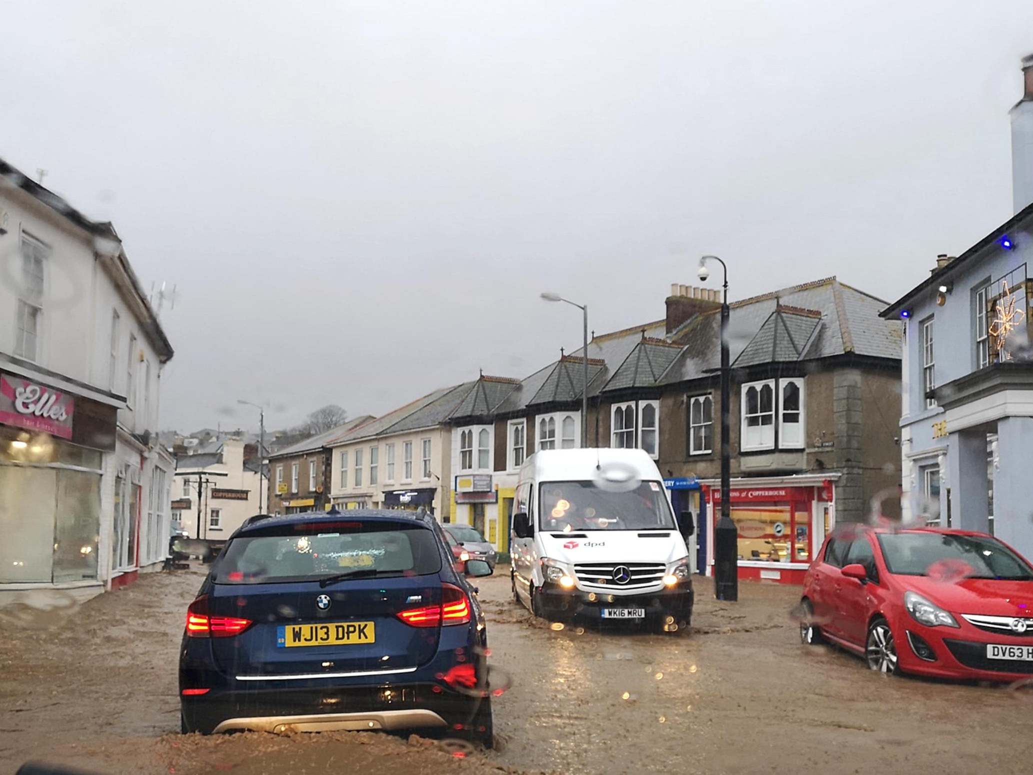 Drivers in Hayle town centre in west Cornwall battle floods on 19 December