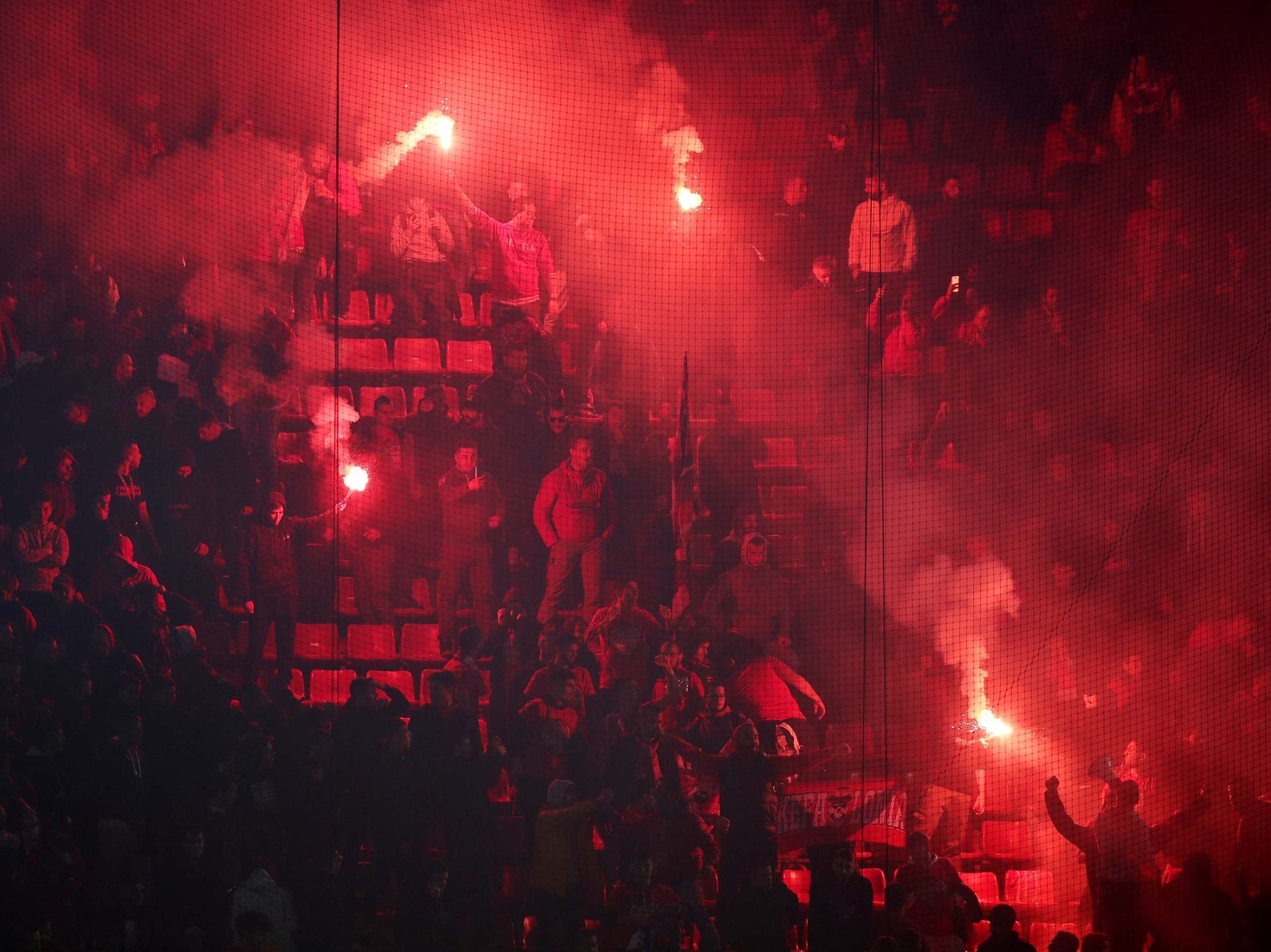 Flairs are lit during Olympiacos' Champions League tie against Crvena Zvezda