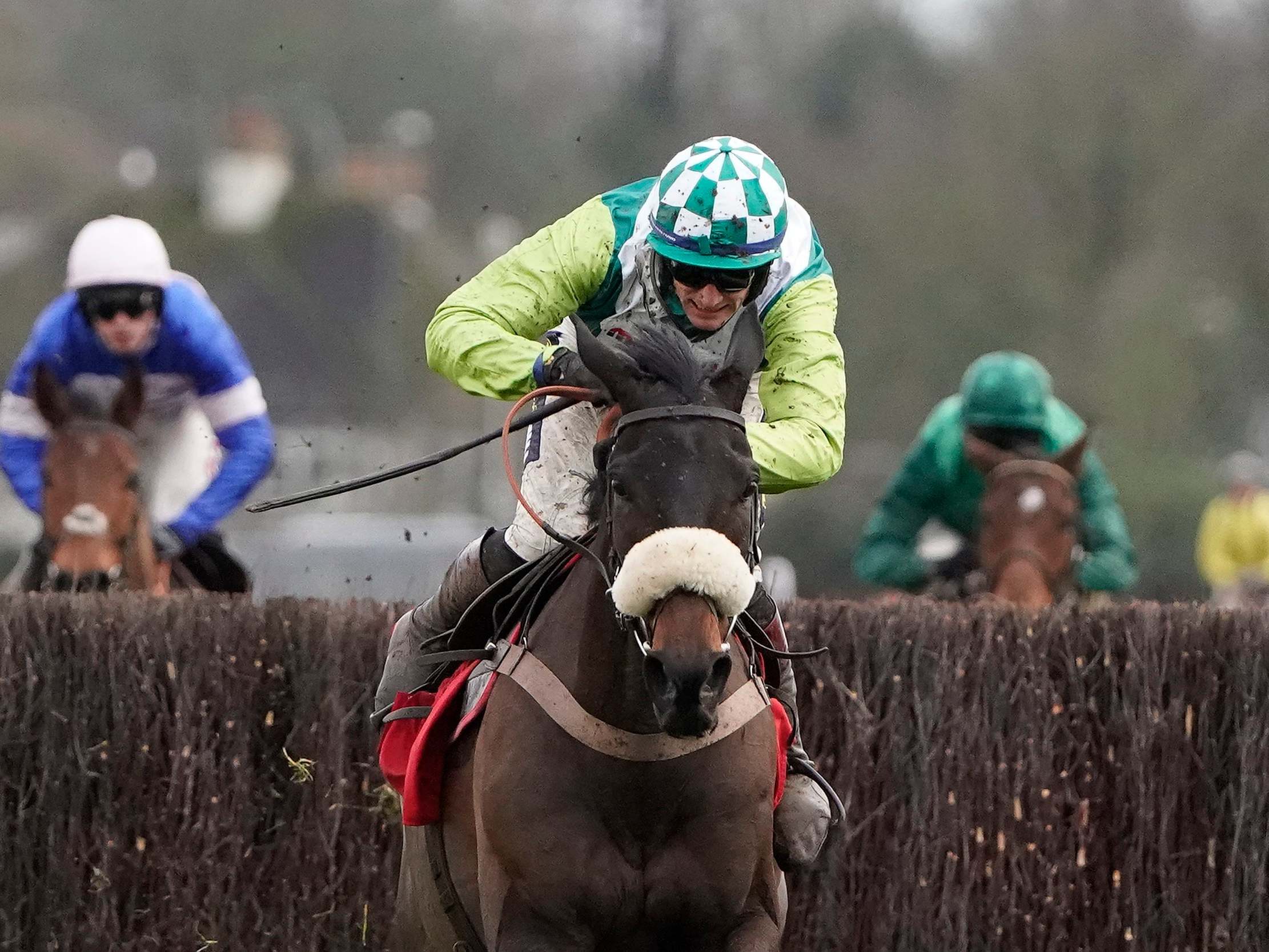 Sam Twiston-Davies rides Clan Des Obeaux to victory in the King George VI Chase