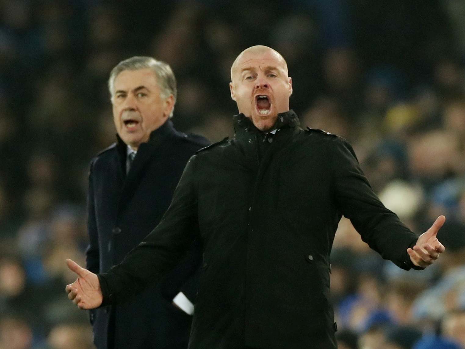 Ancelotti looks on as Dyche shouts from the touchline