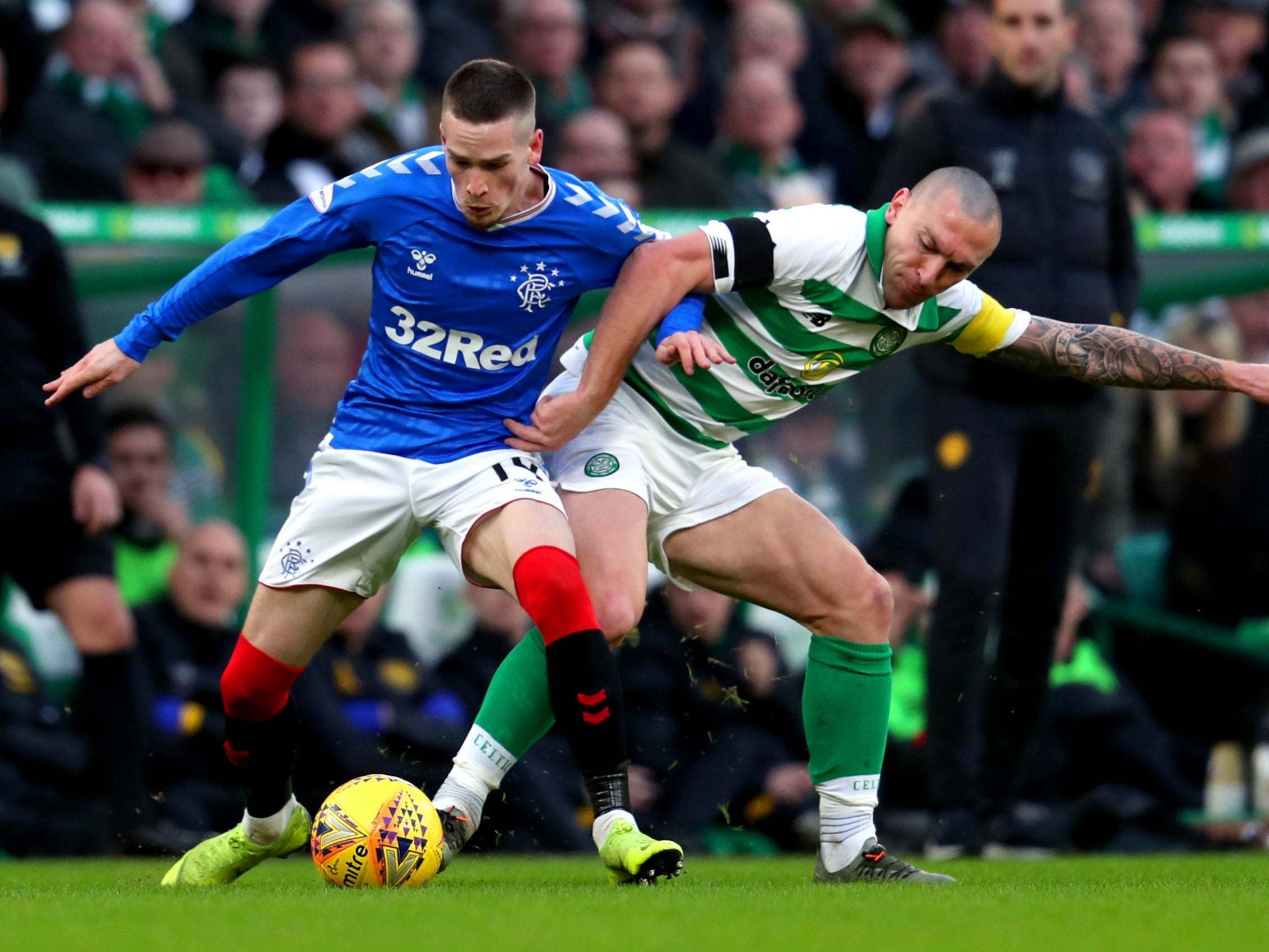 Rangers' Ryan Kent and Celtic's Scott Brown tussle for possession