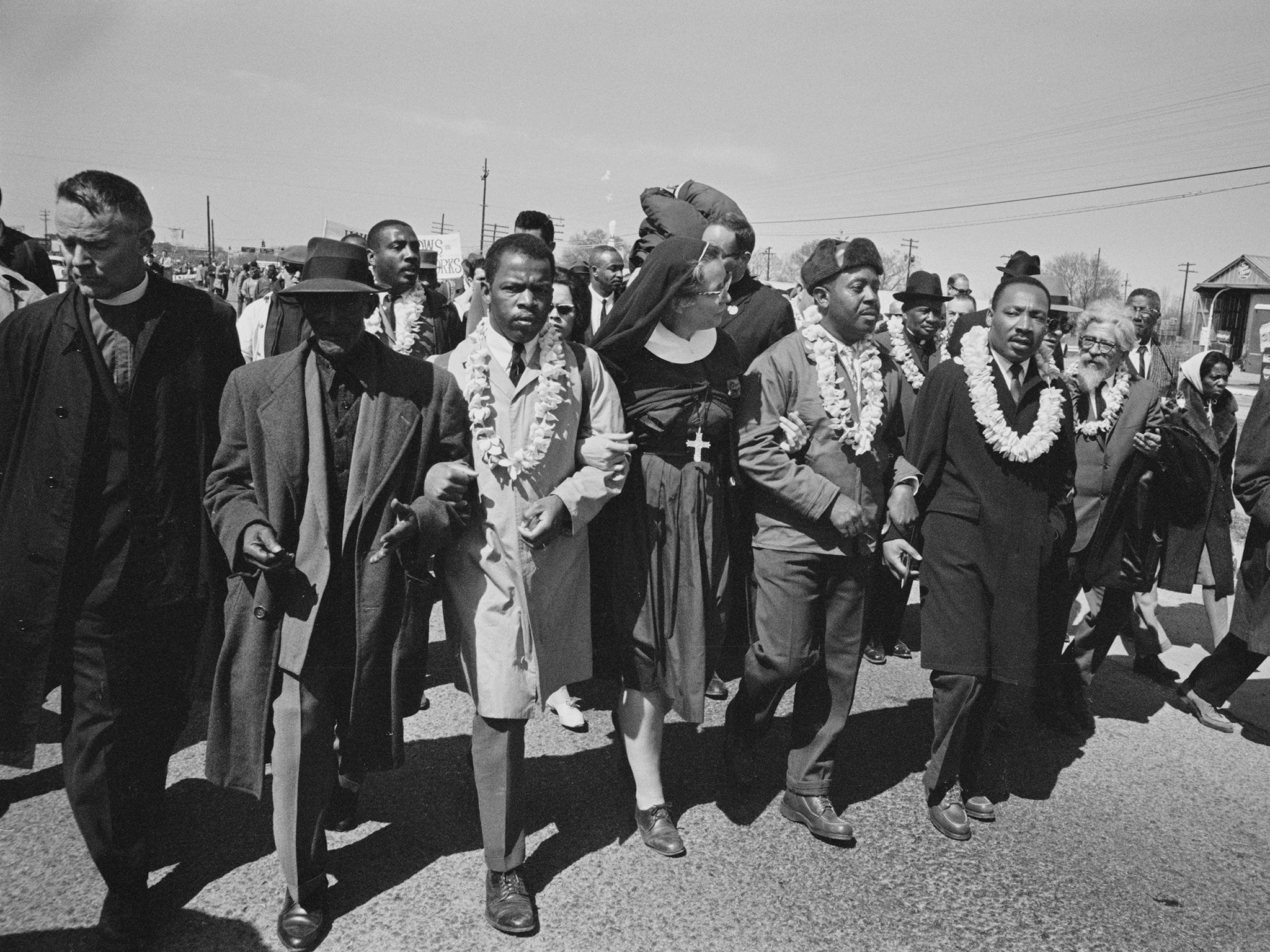 Mr Lewis marching with Martin Luther King Jr and other members of the 'Big Six'