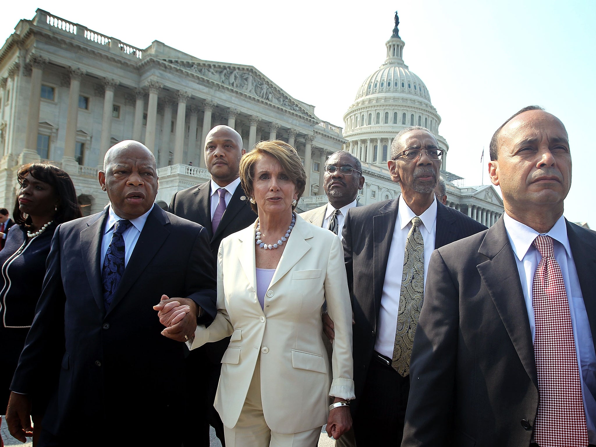 Democratic members participate in a walkout in protest of Mr Trump's inauguration