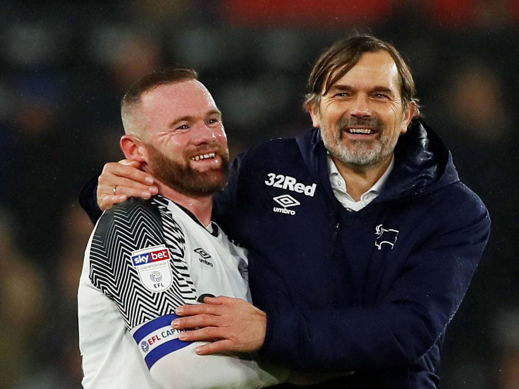 Wayne Rooney and Phillip Cocu celebrate after Derby beat Barnsley