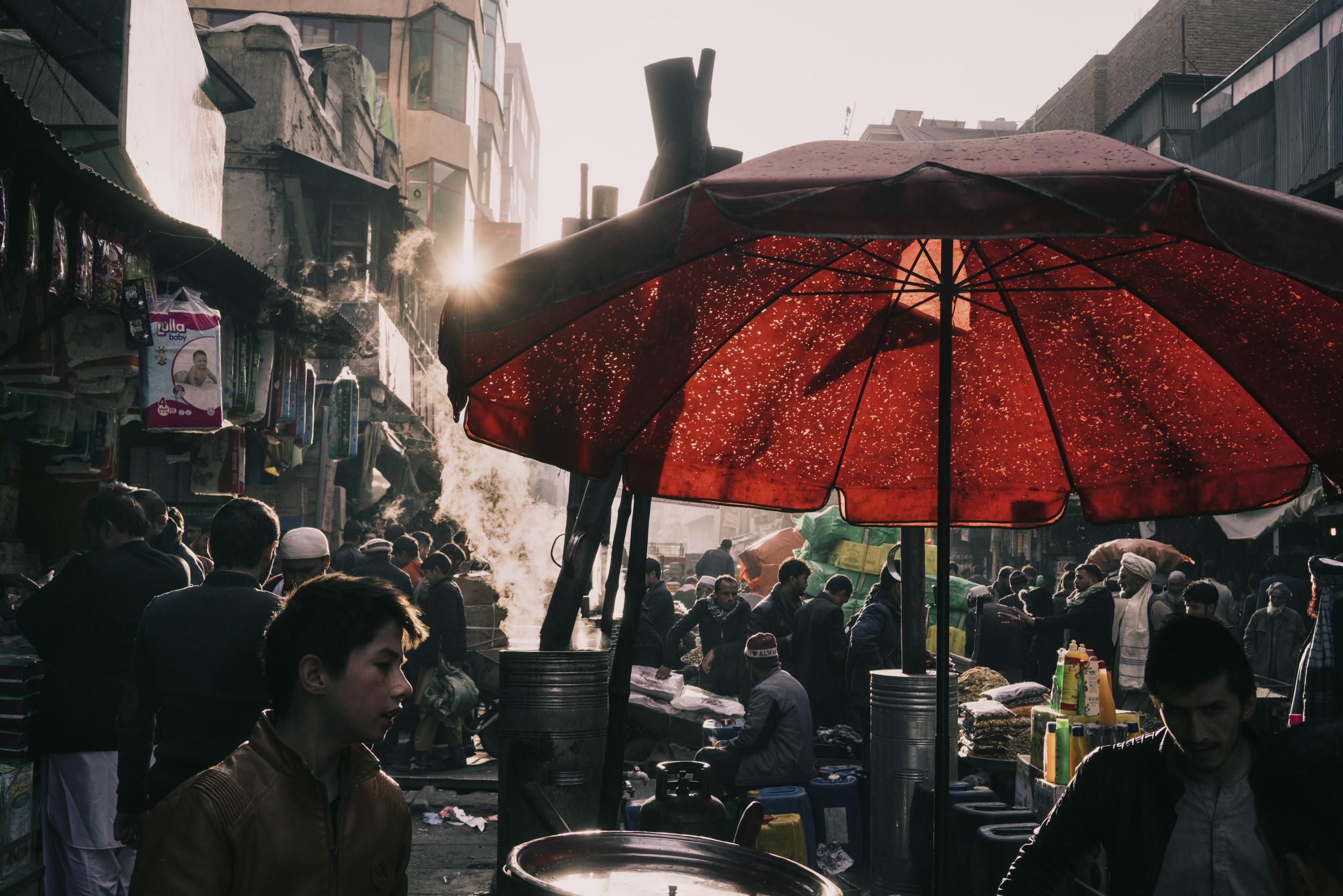 Shoppers crowd a market in Kabul, Afghanistan