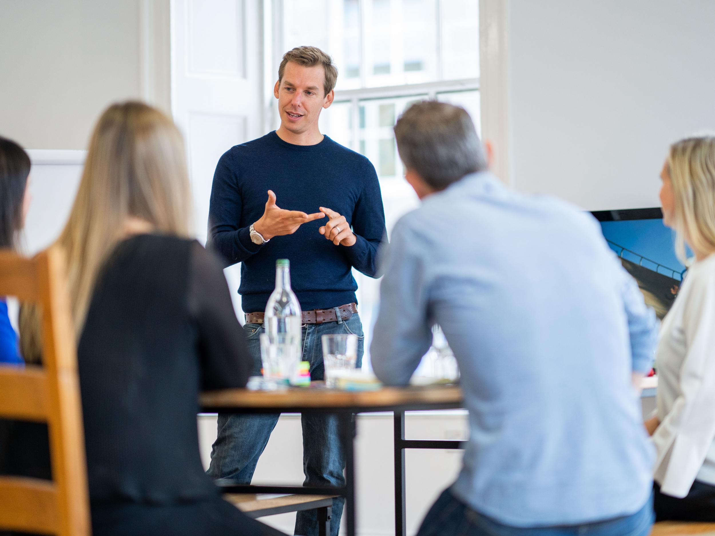 David Carry giving a talk to business people