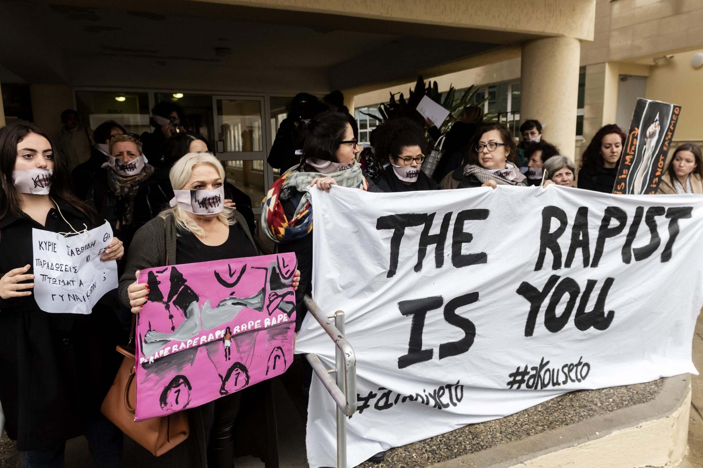 Activists stage a protest in support of a British teenager accused of fasely claiming she was raped by Israeli tourists, during her trial in eastern Cyprus in 2019