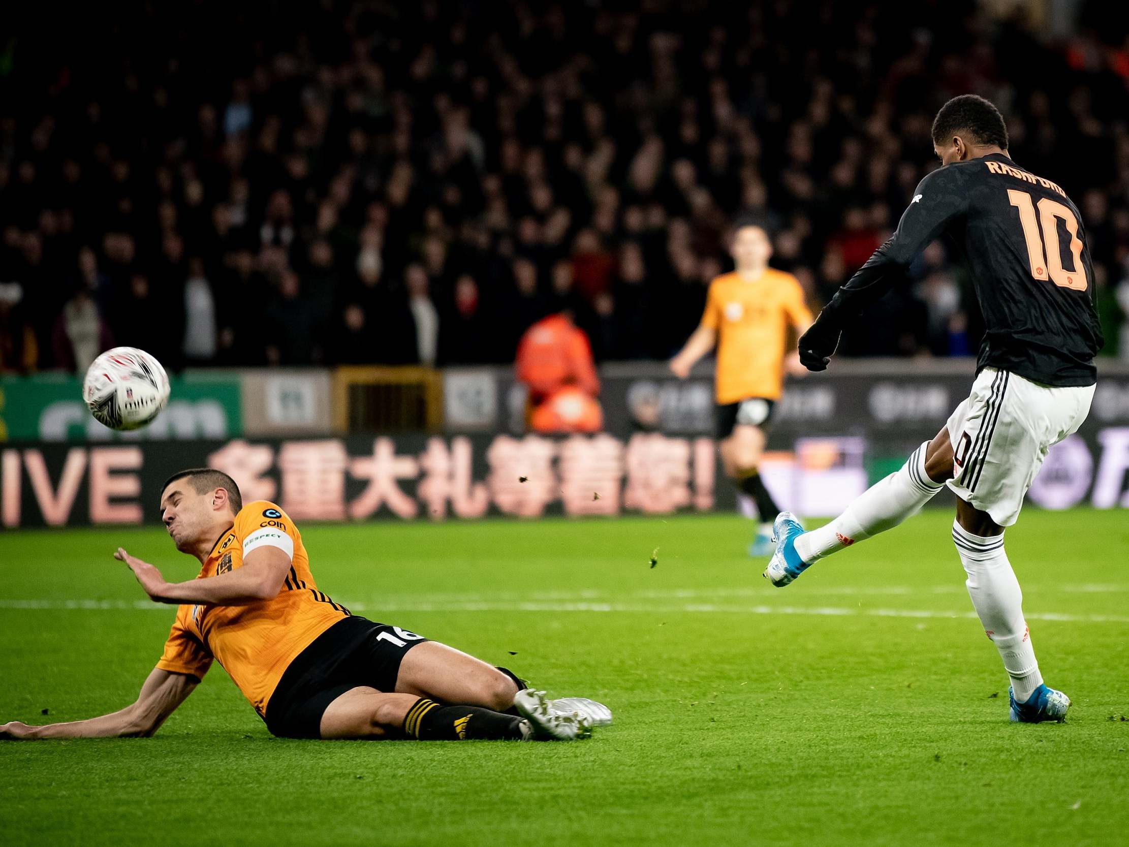 Marcus Rashford's shot deflects off Conor Coady before hitting the bar