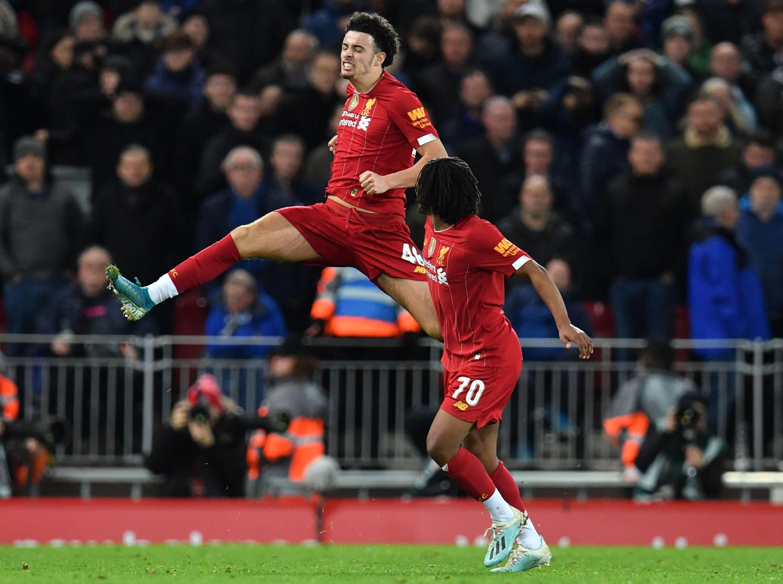 Curtis Jones celebrates his stunning goal