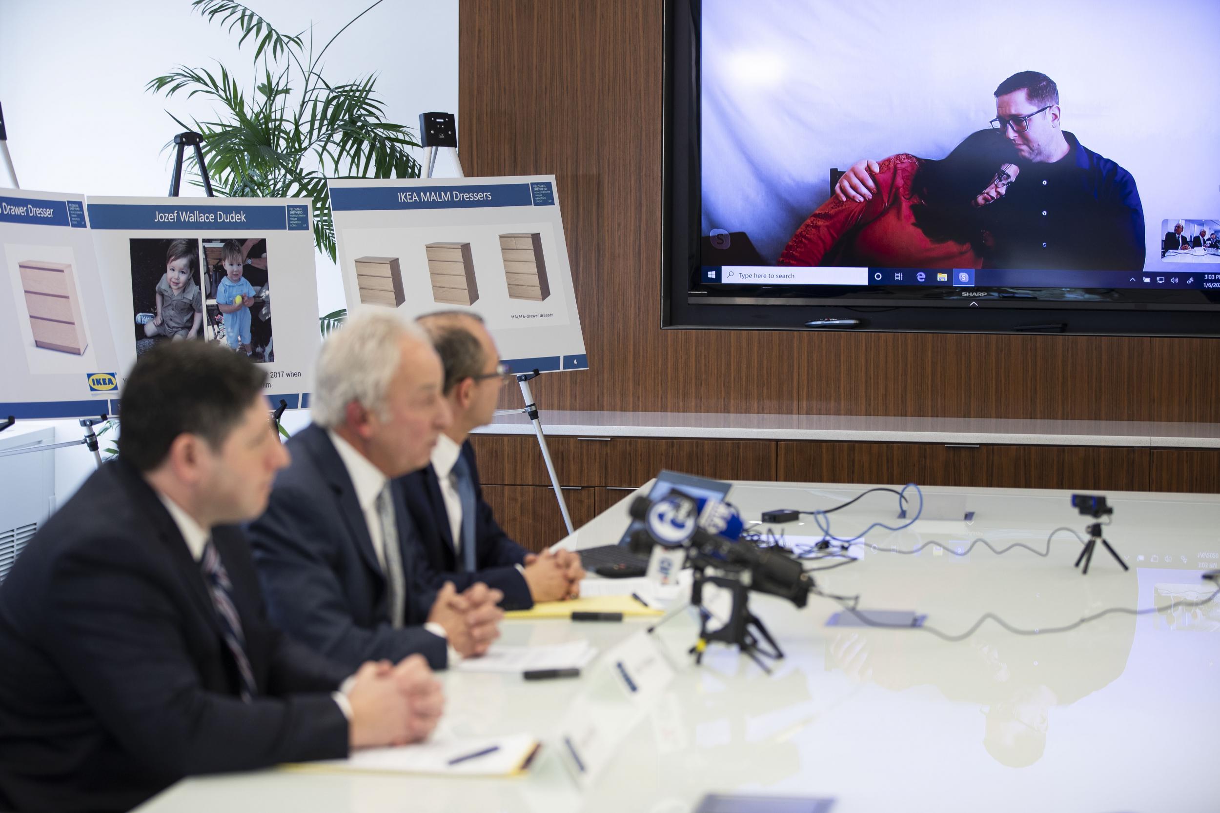 Joleen and Craig Dudek, top right, comfort each other as they join a news conference in Philadelphia via video