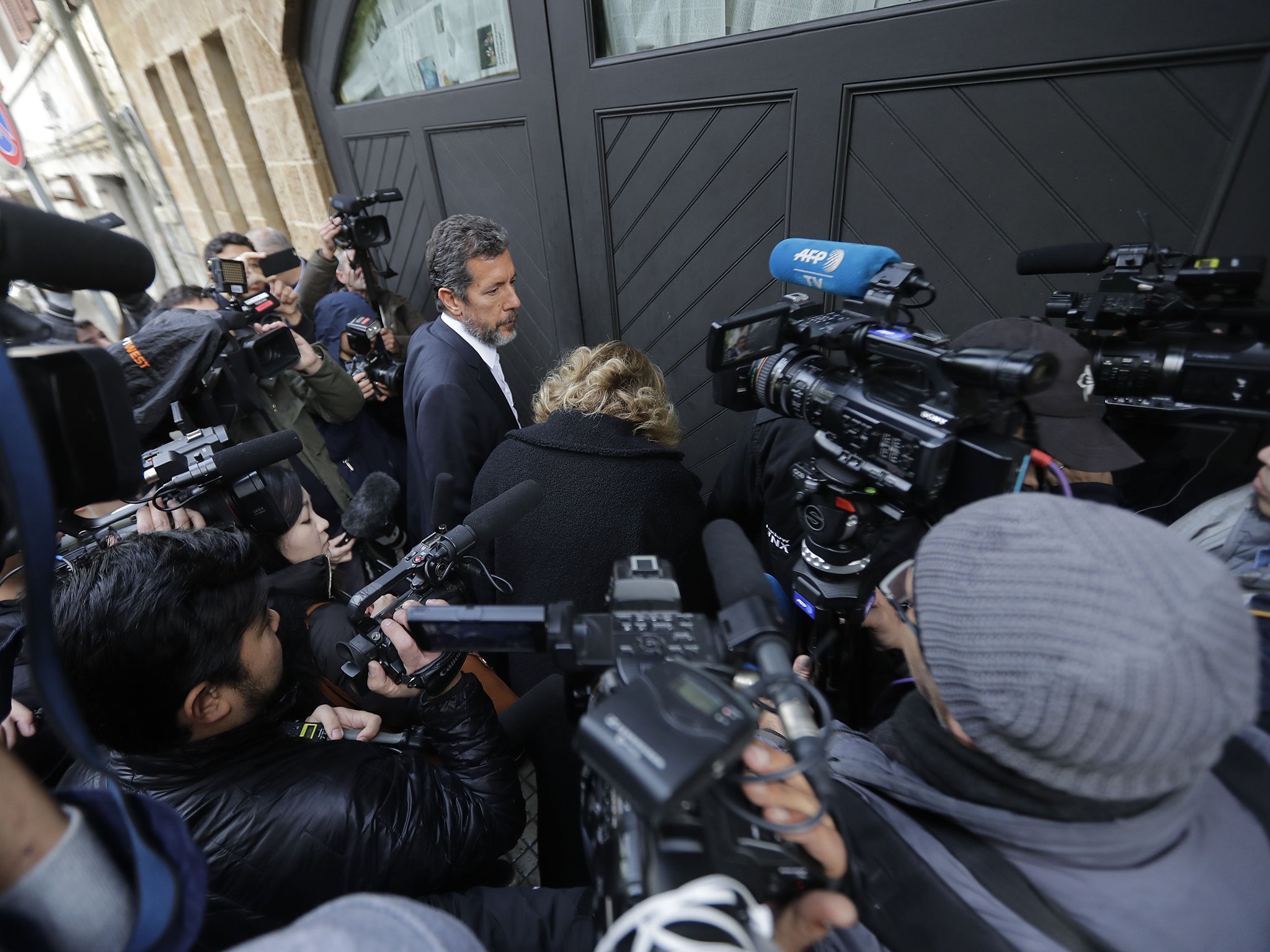 Journalists gather outside house reportedly belonging to Mr Ghosn in Beirut