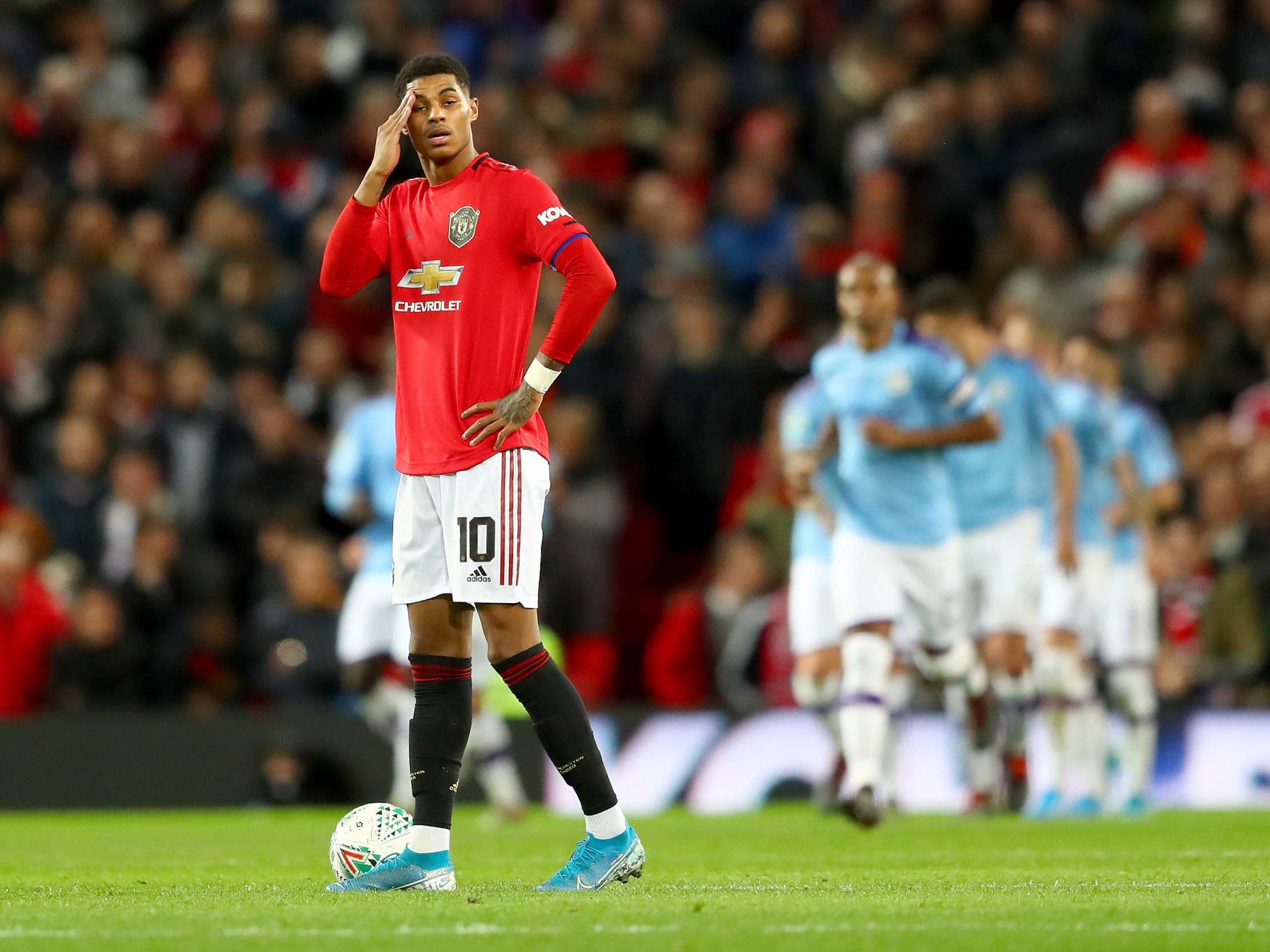 Marcus Rashford reacts after Manchester City's third goal