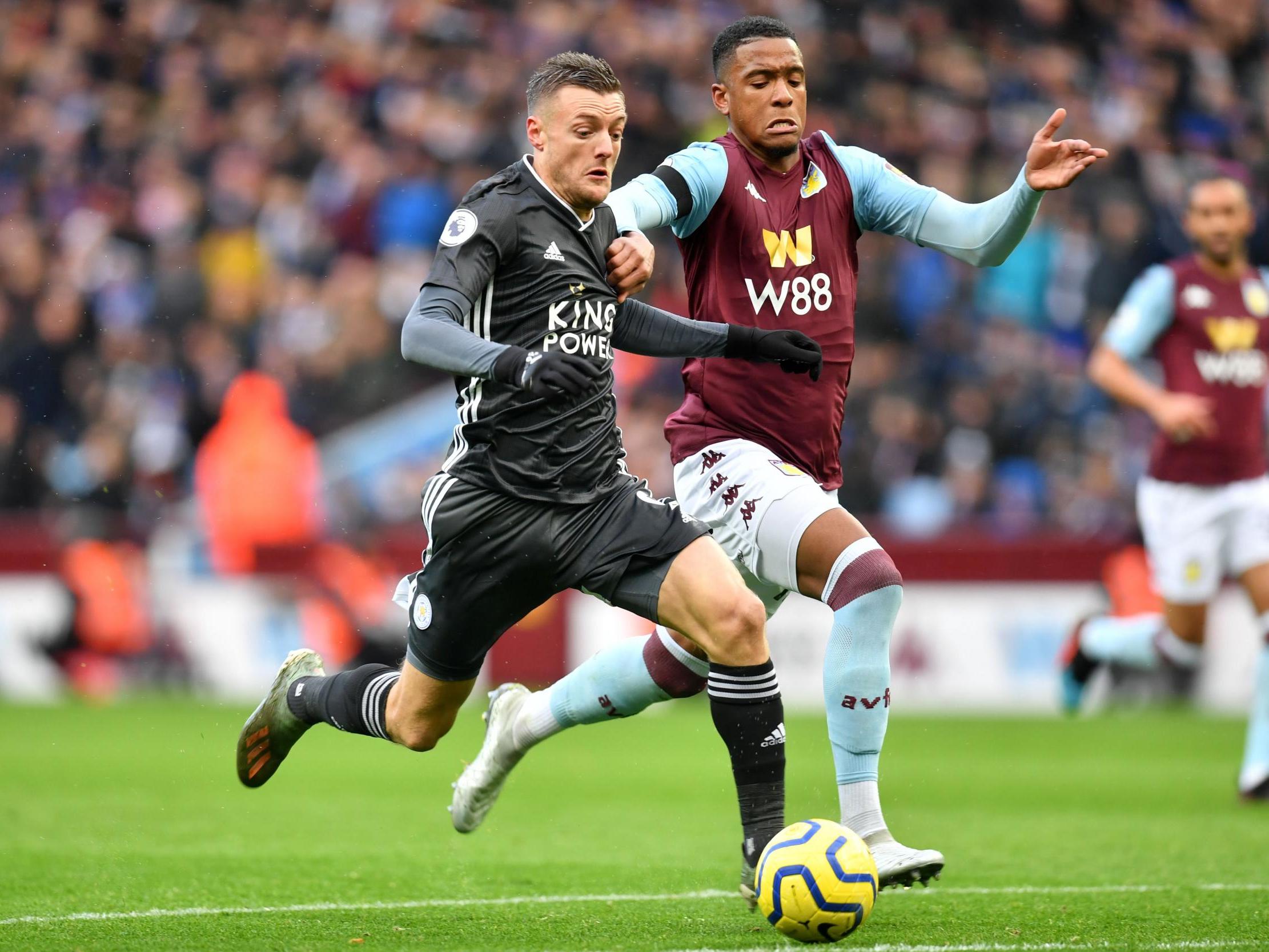 Leicester City's Jamie Vardy vies with Aston Villa's Ezri Konsa