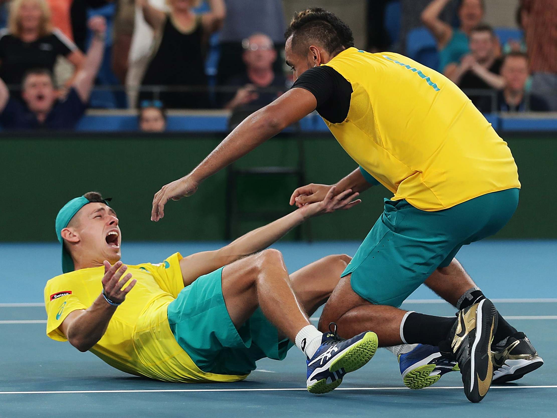 Alex De Minaur and Nick Kyrgios celebrate their victory in the ATP Cup quarter-final over Great Britain