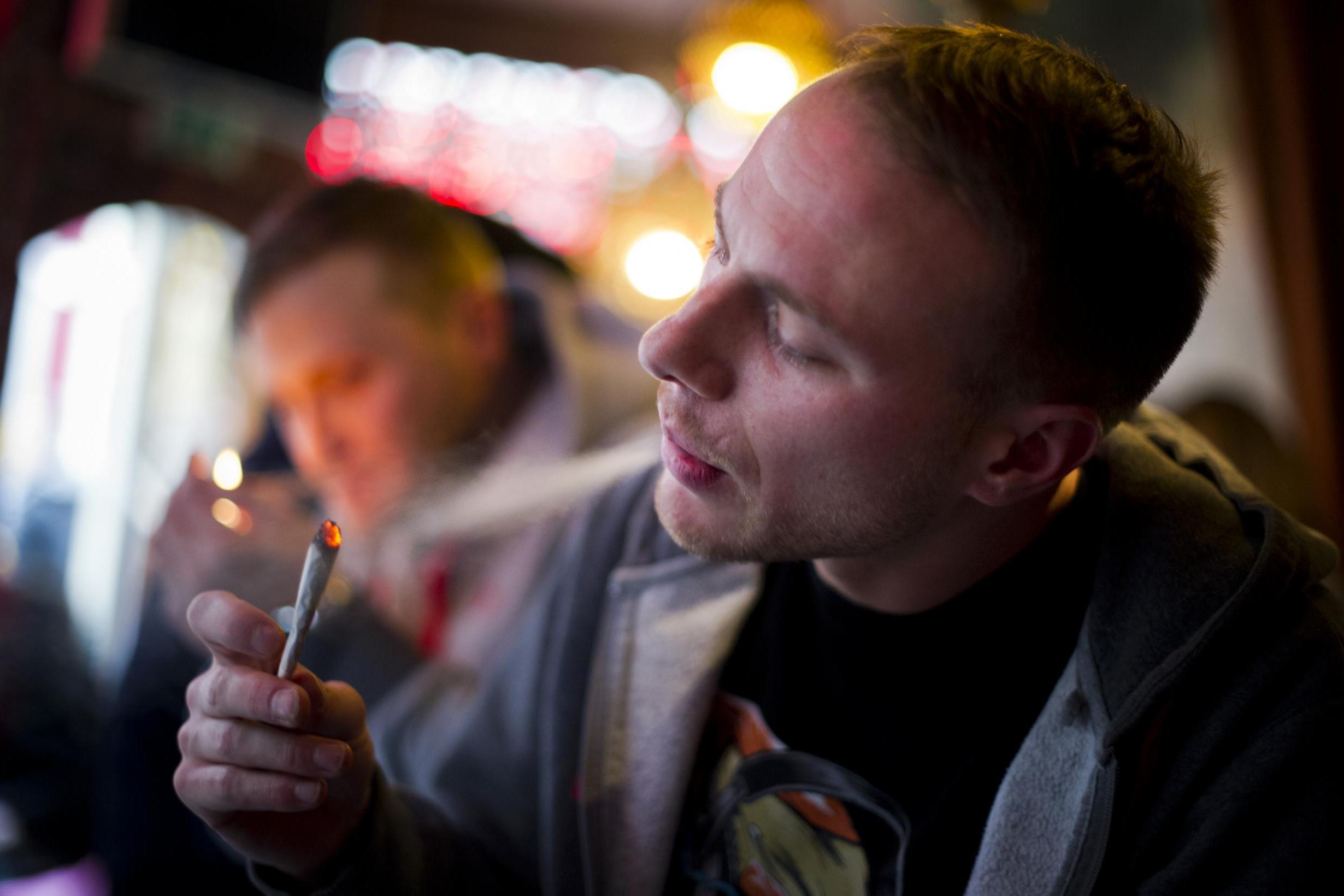 Societal ill? A cannabis smoker in the Netherlands (Getty)