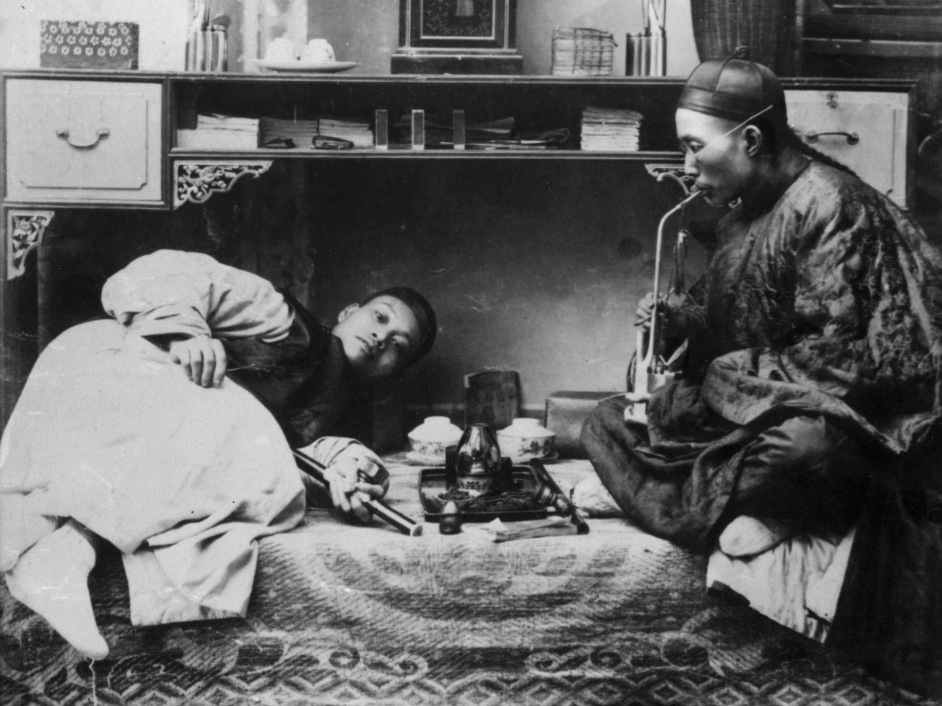 Chinese opium smokers circa 1865 (Getty)