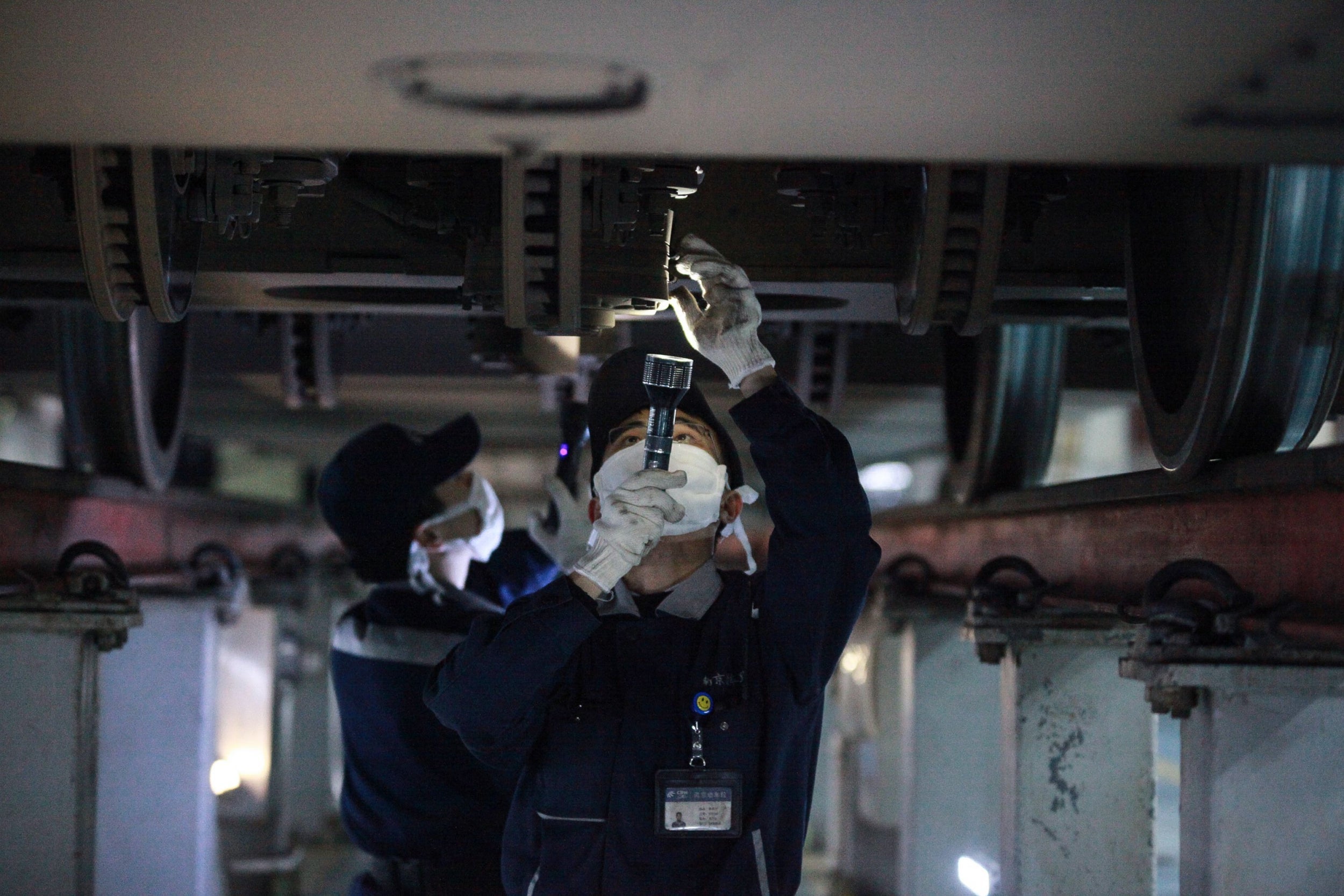 A worker checking a new bullet train in Jiangsu. The province is among China's wealthiest and most populous